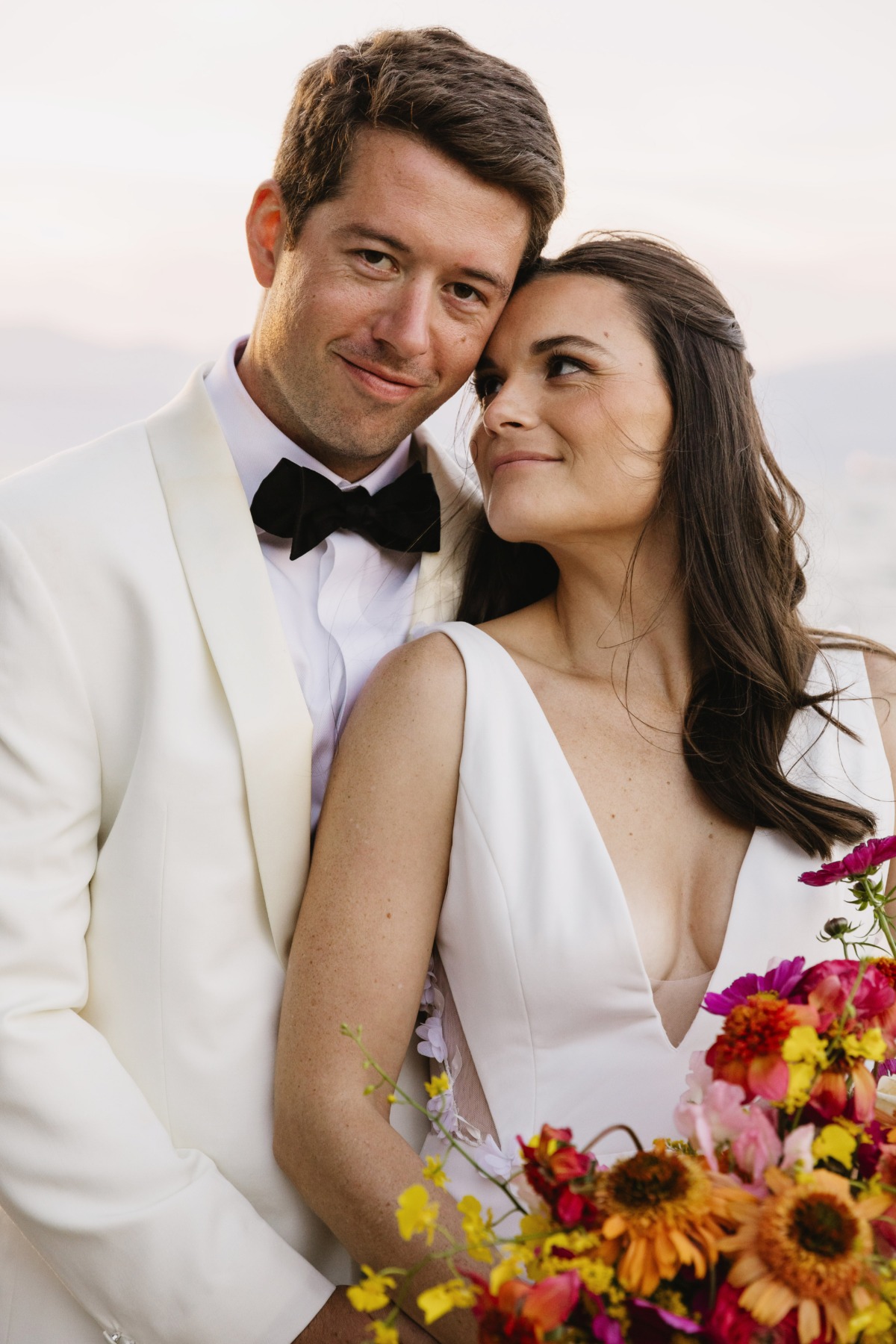 groom in dinner jacket and bride in minimalist gown