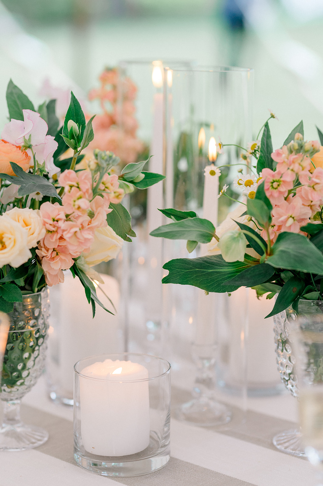 peach flowers and candles for wedding reception