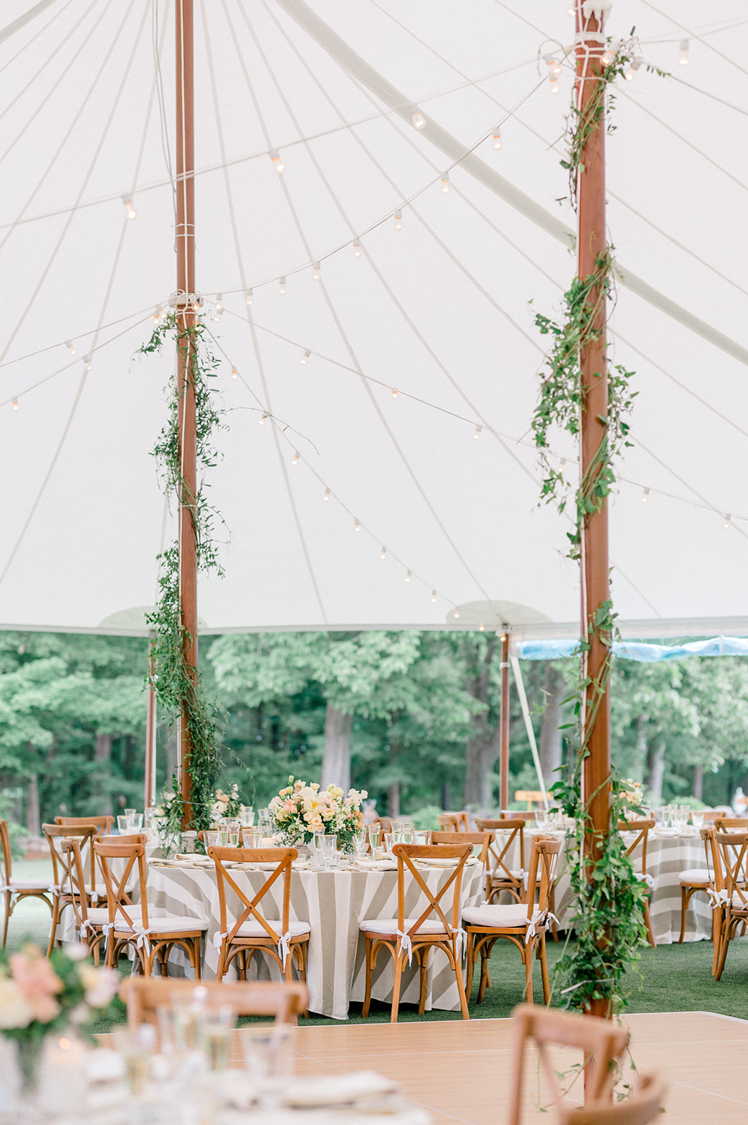 tented wedding reception with citrus flowers