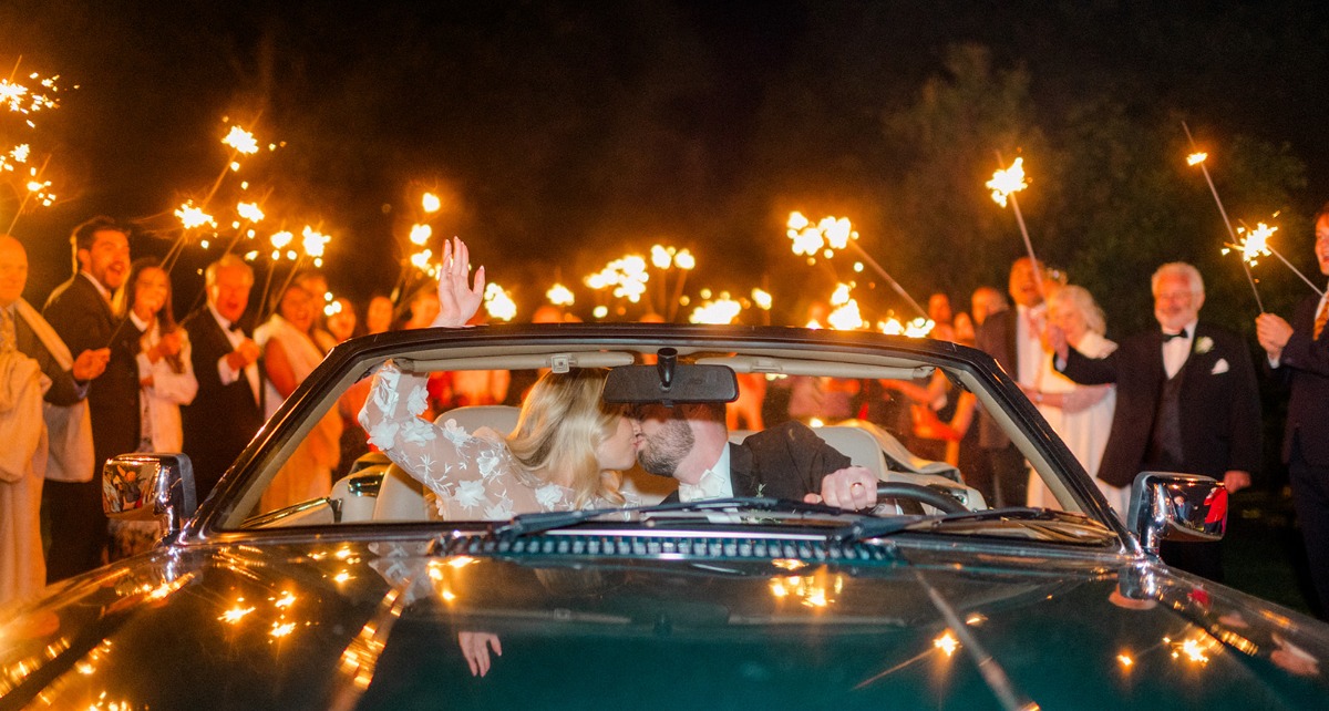 bride and groom sparkler exit in vintage car