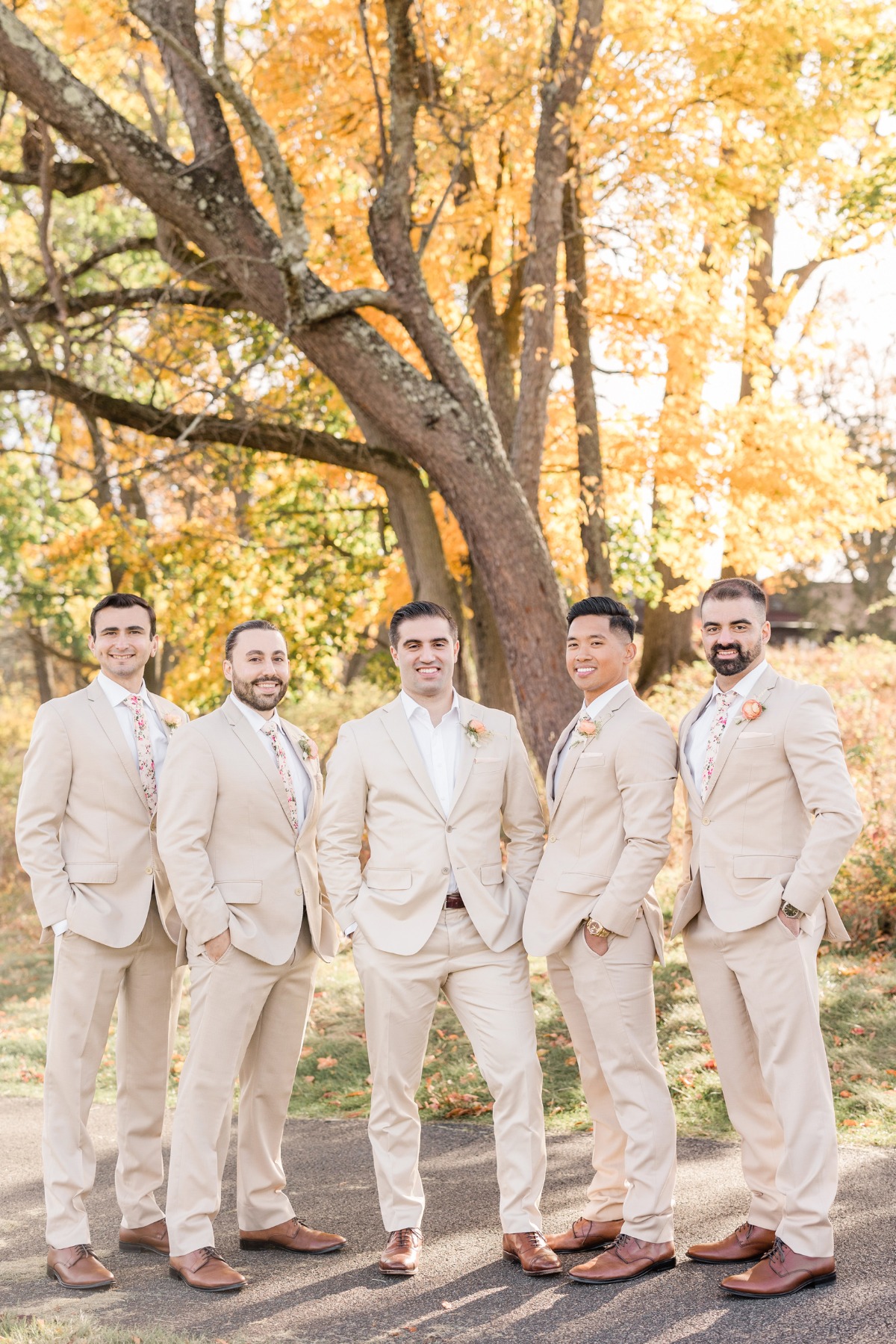 cream suits with peach boutonnieres