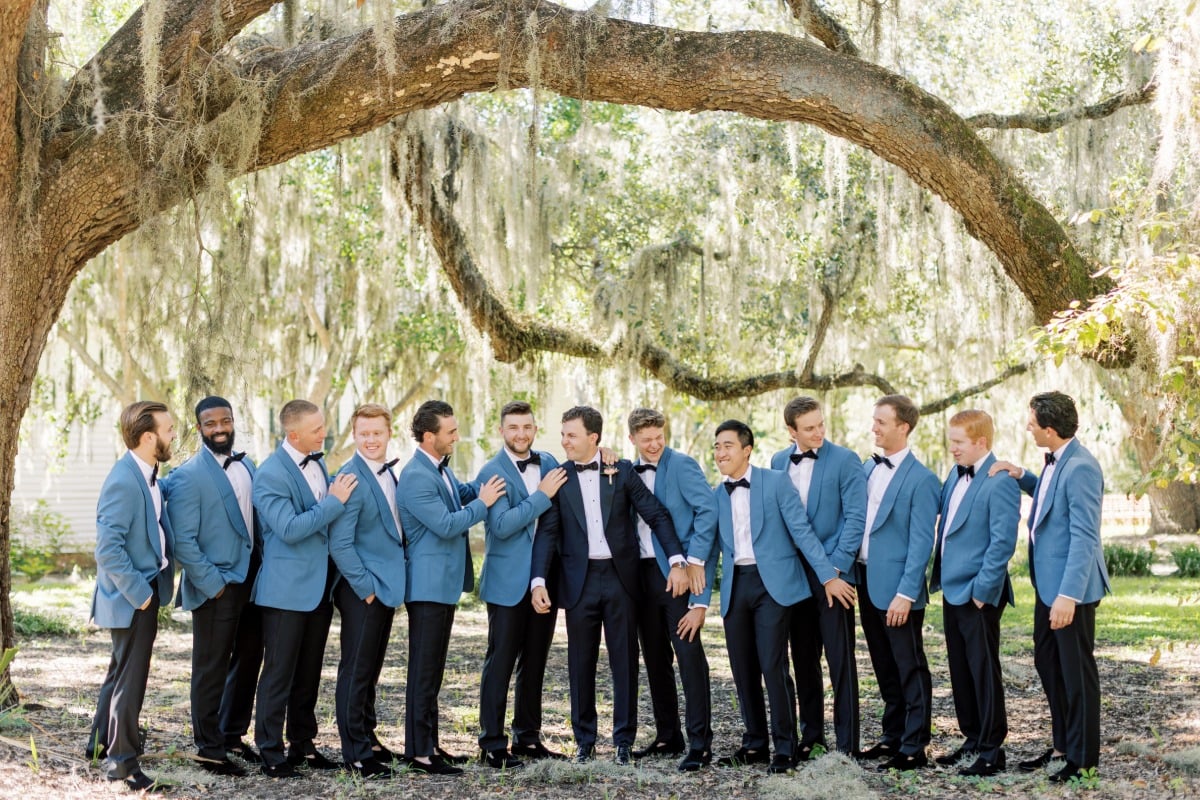 groomsmen with blue tuxedo jackets