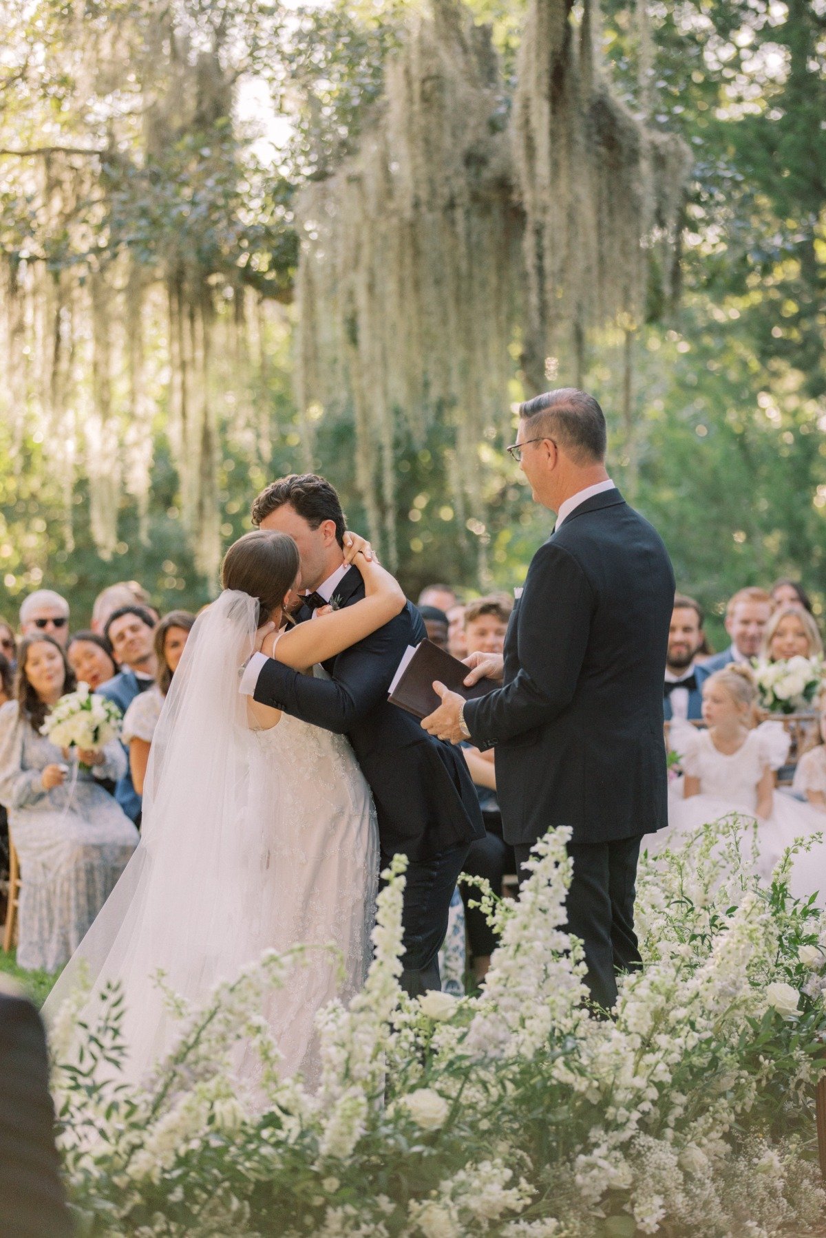 wedding ceremony under giant oak tree with moss