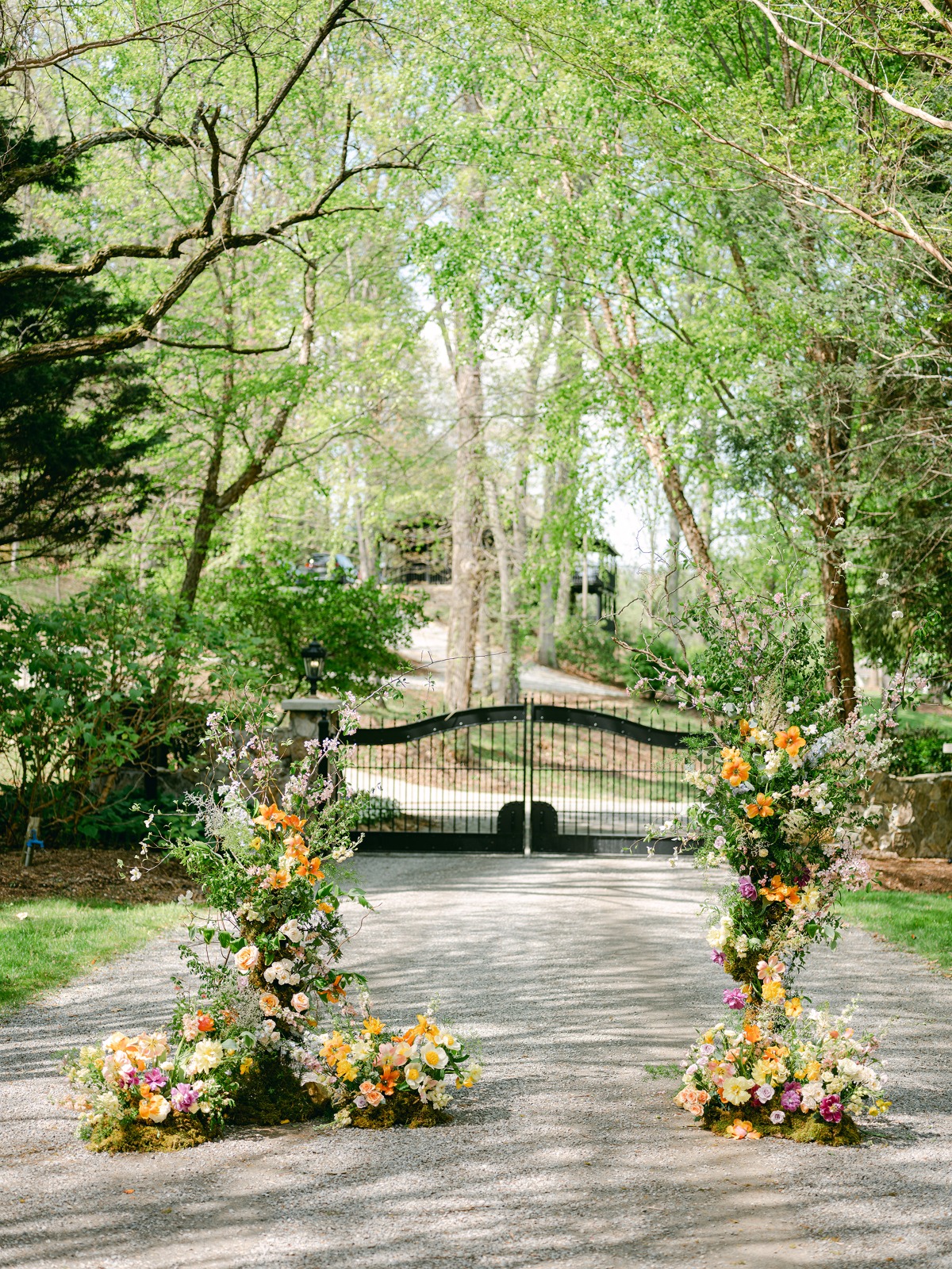 colorful whimsical asymmetrical floral arch ideas for wedding