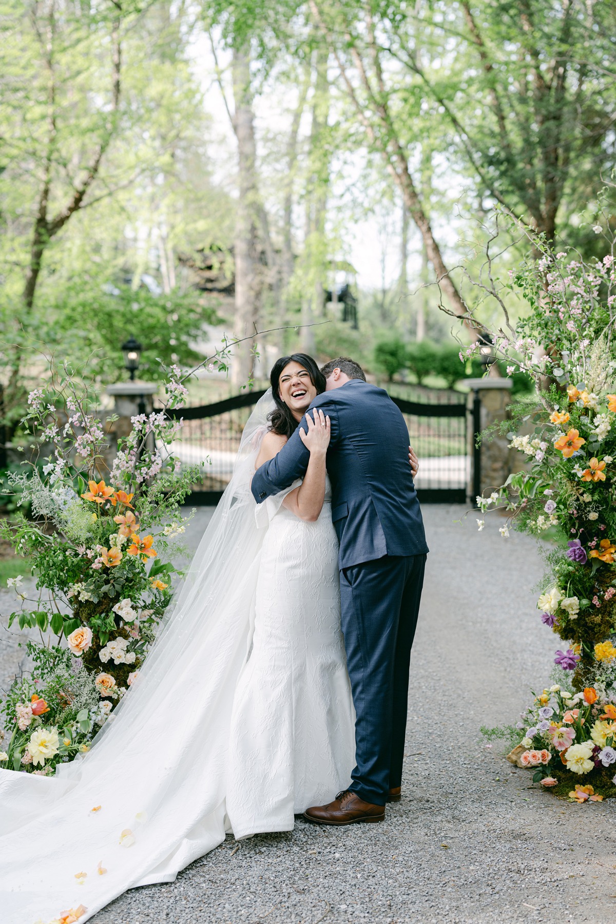 whimsical colorful wedding ceremony floral arch