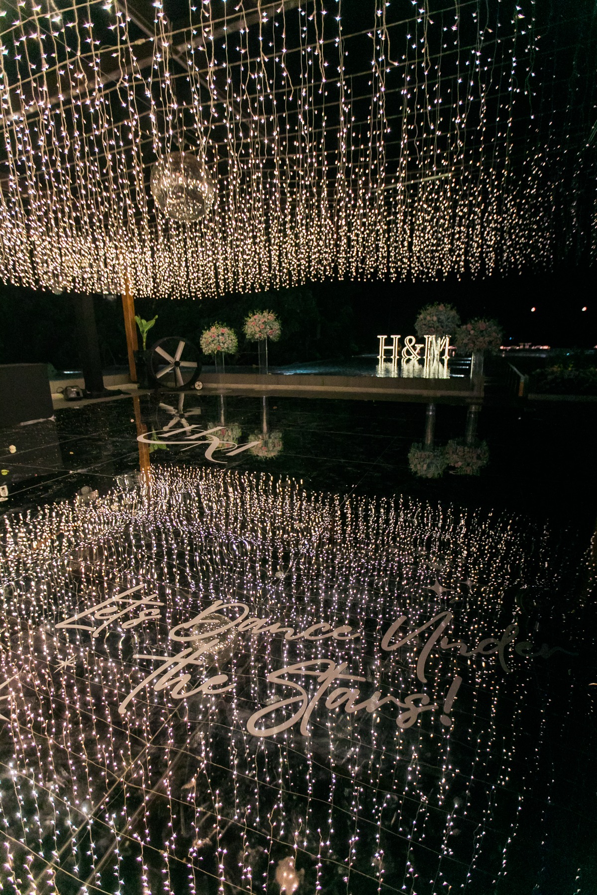 mirrored dance floor with twinkle lights for wedding