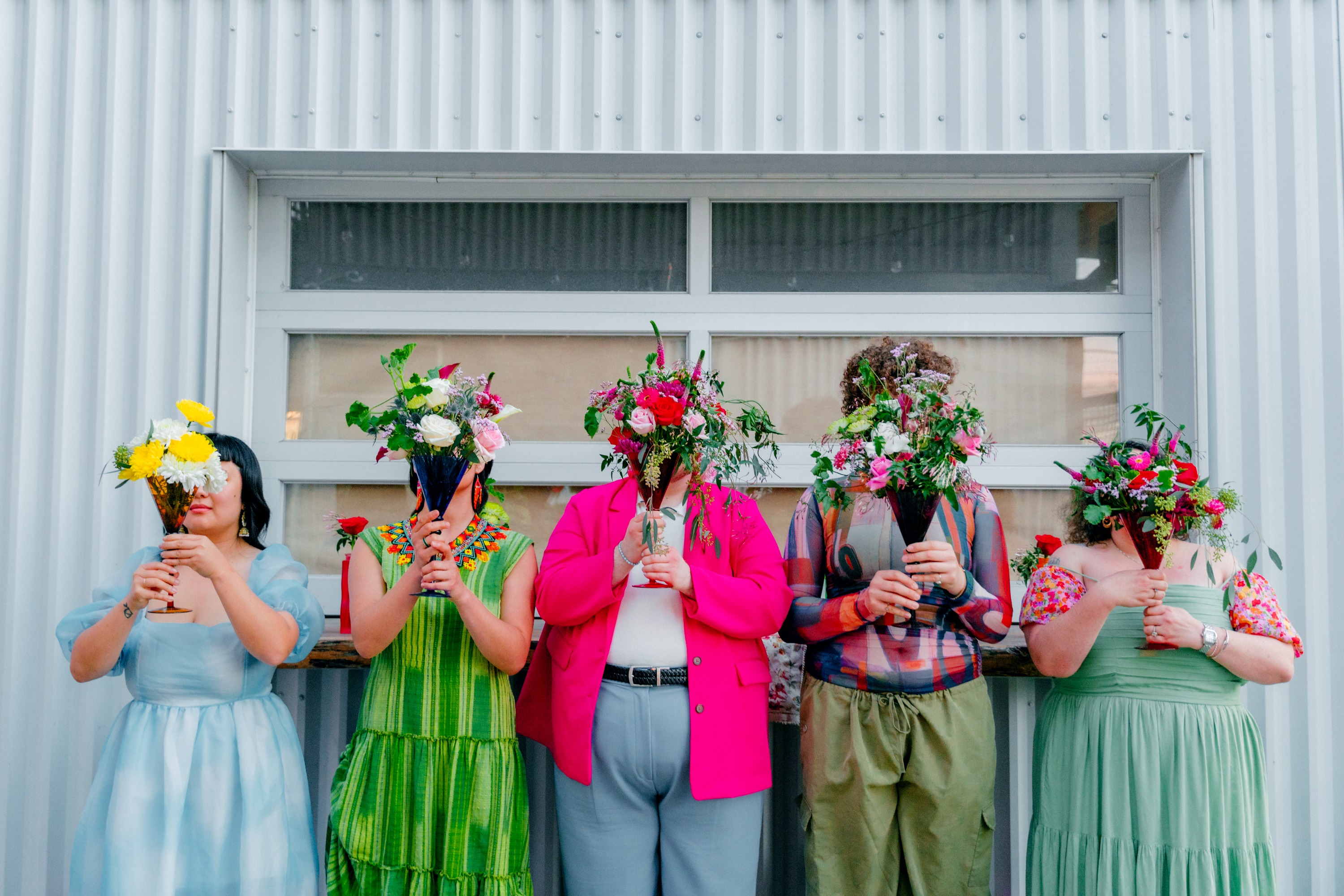 Rainbow Pride themed bridal party inspiration with vase bouquets