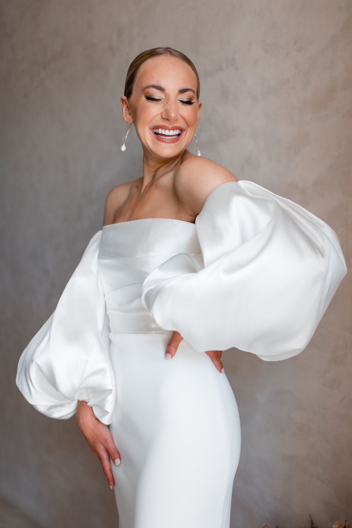 bride in a silk midi dress with voluminous sleeves