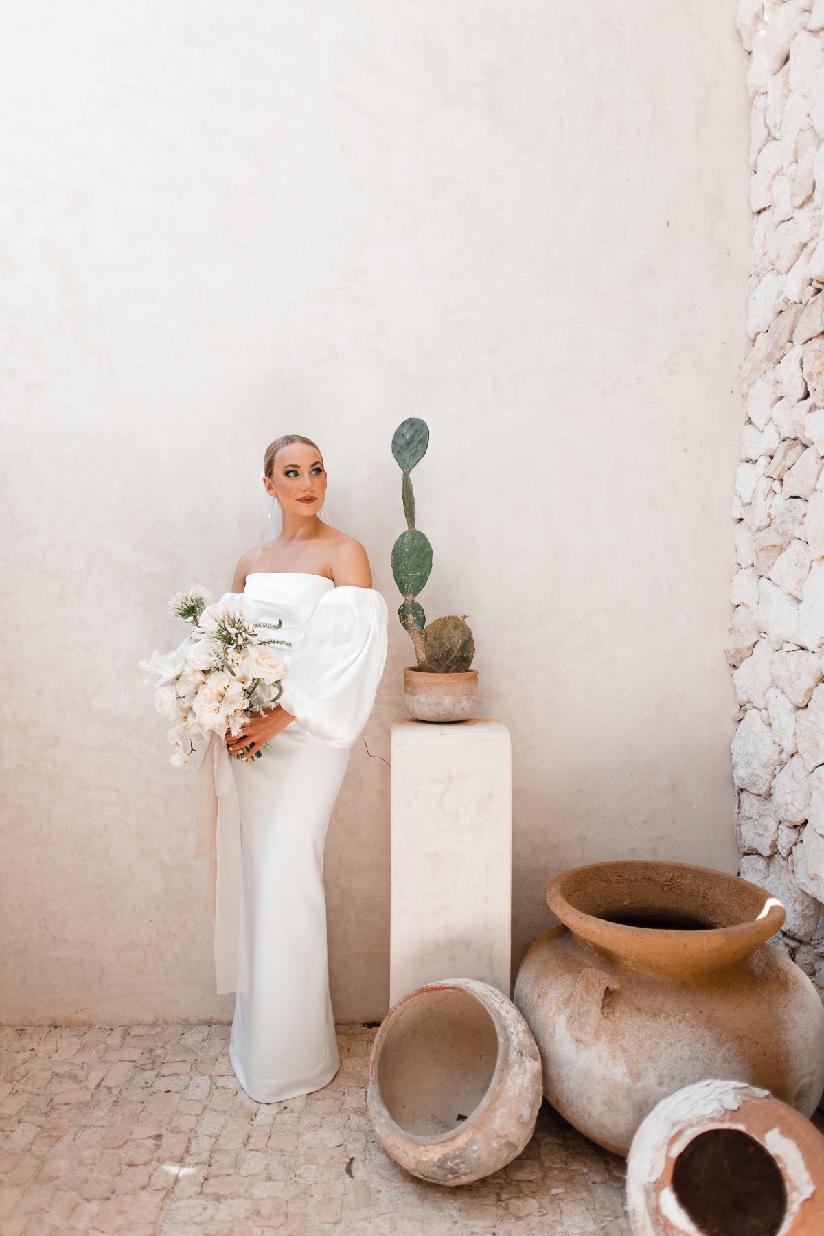 bride posing by a cactus in mexico