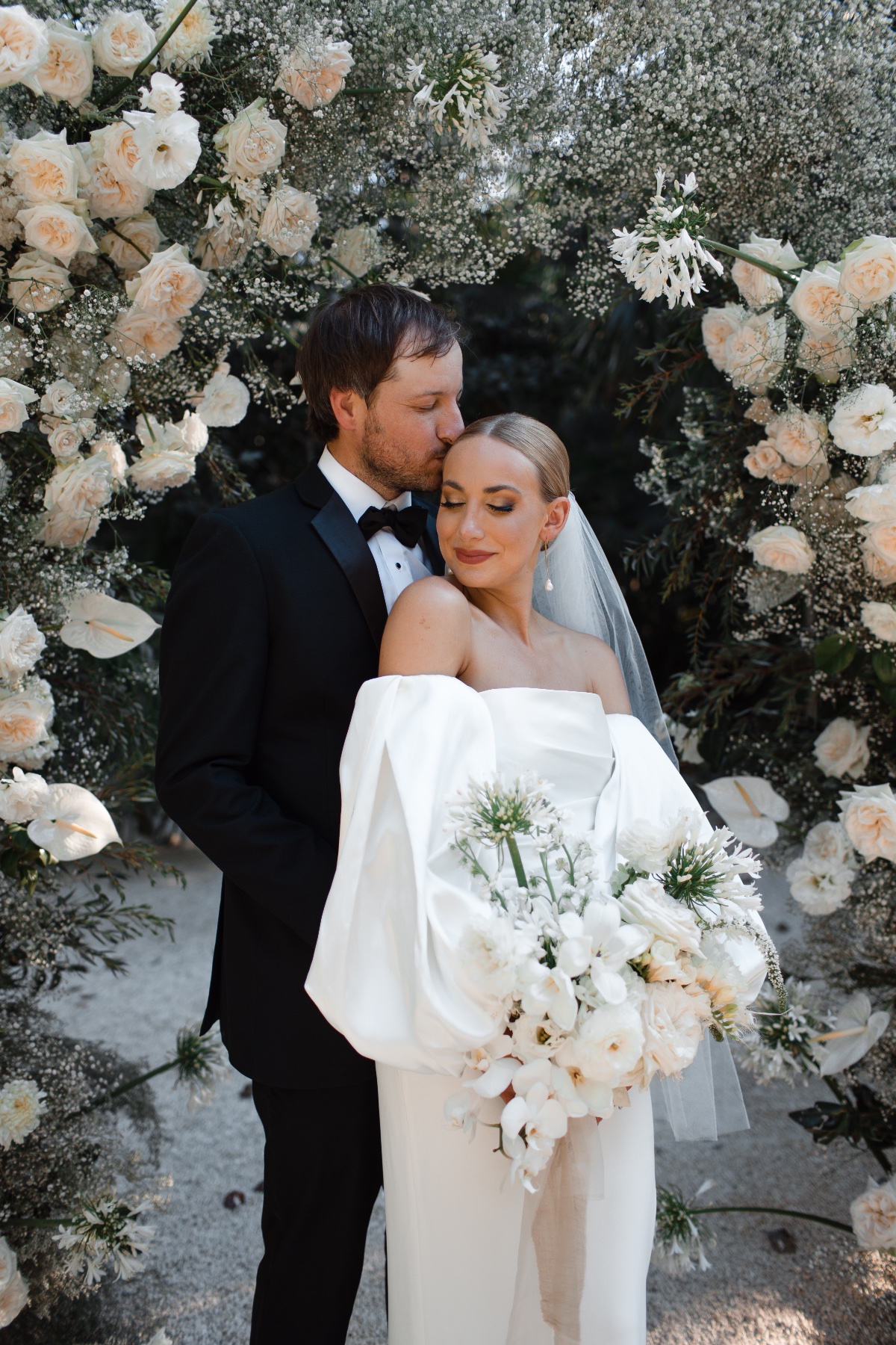 formal elopement ceremony with peach and white flowers