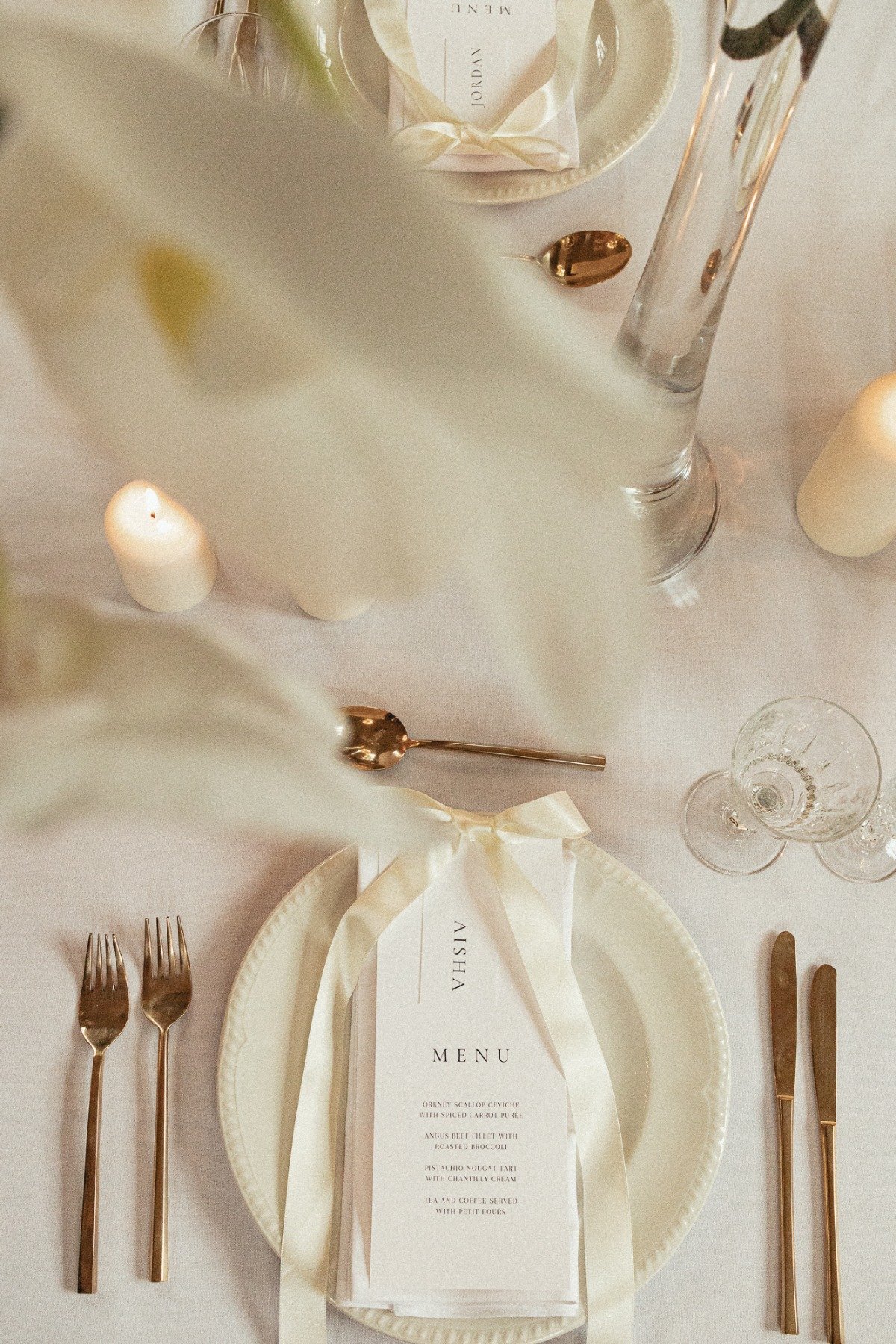 simple ivory and gold tablescape with bows