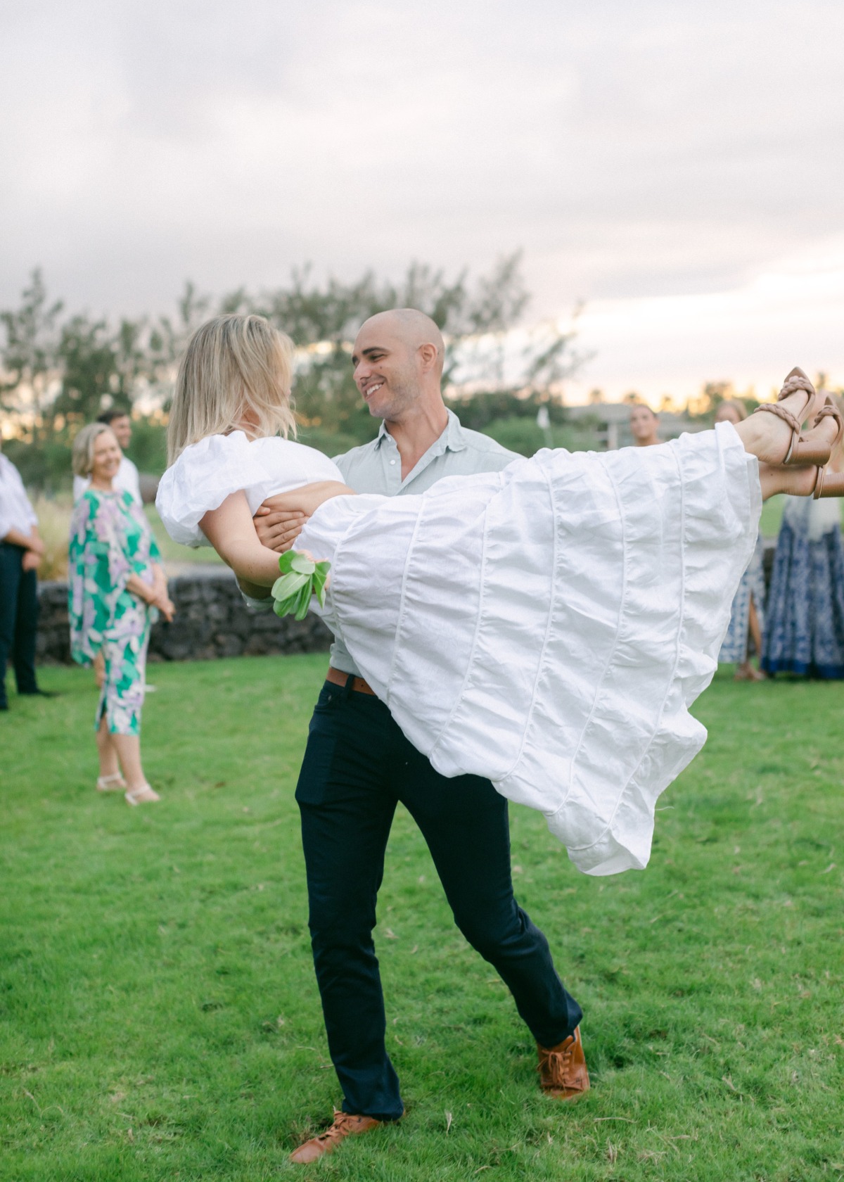 bride and groom at wedding welcome party in hawaii