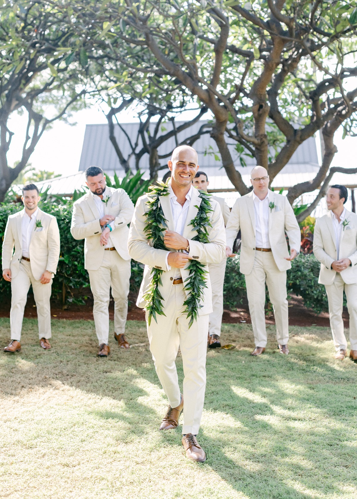 groom and groomsmen in tan linen suits in hawaii