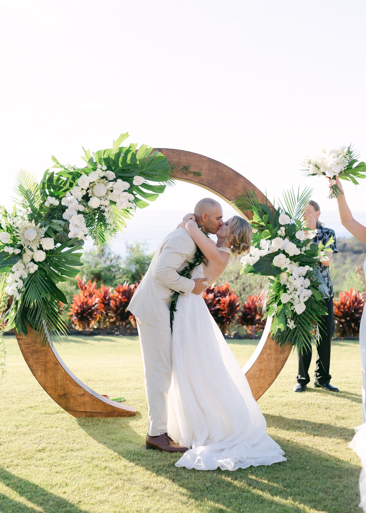 tropical wedding ceremony in hawaii with white and green flowers