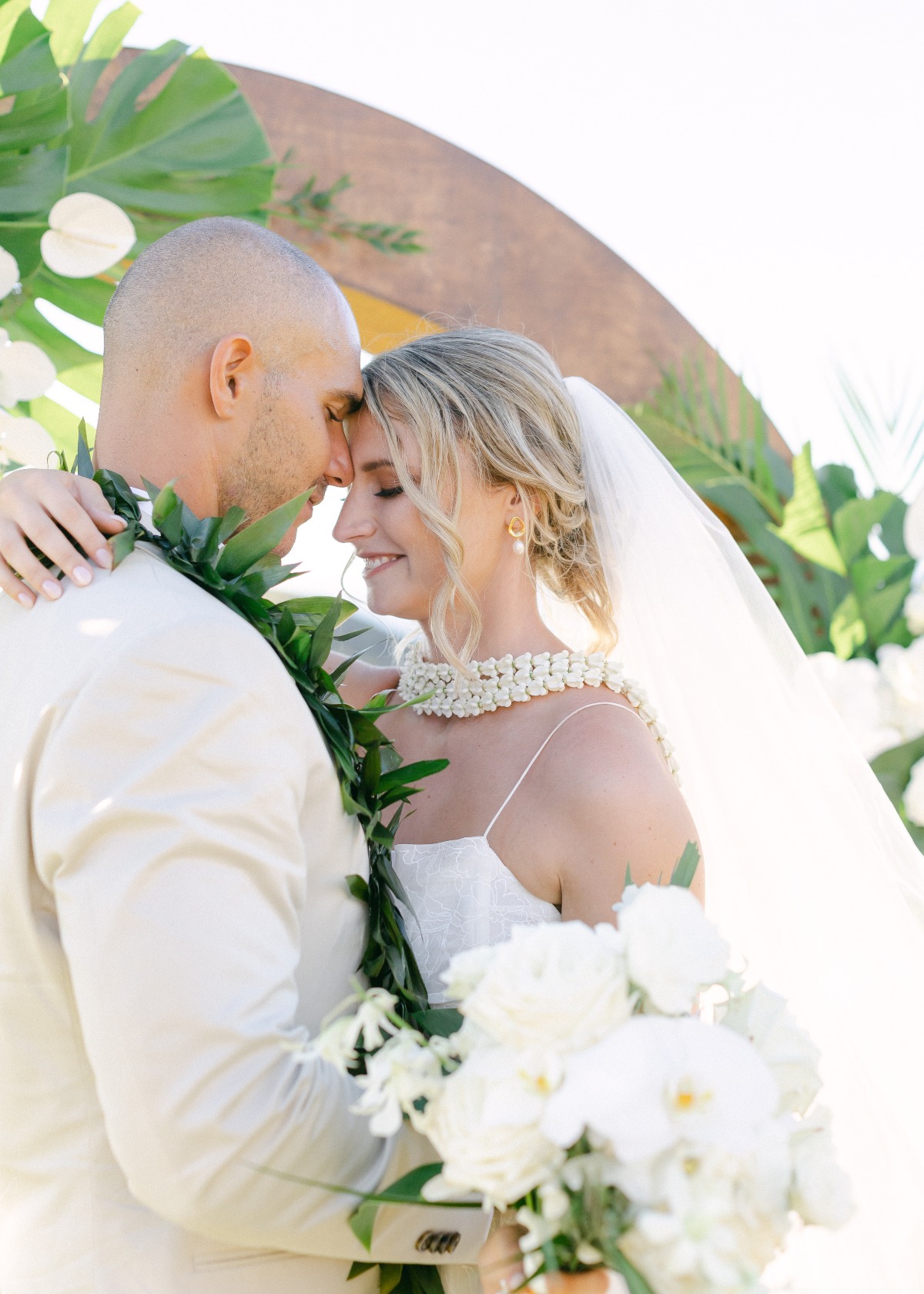 bride and groom at tropical wedding ceremony in hawaii