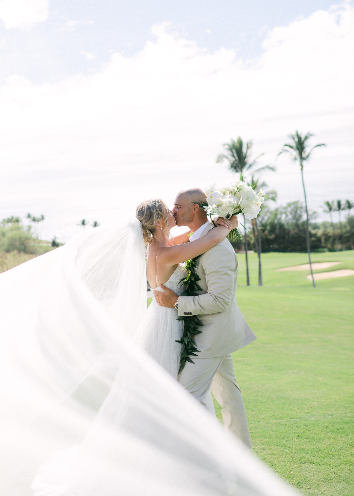 green and white tropical wedding on a golf course