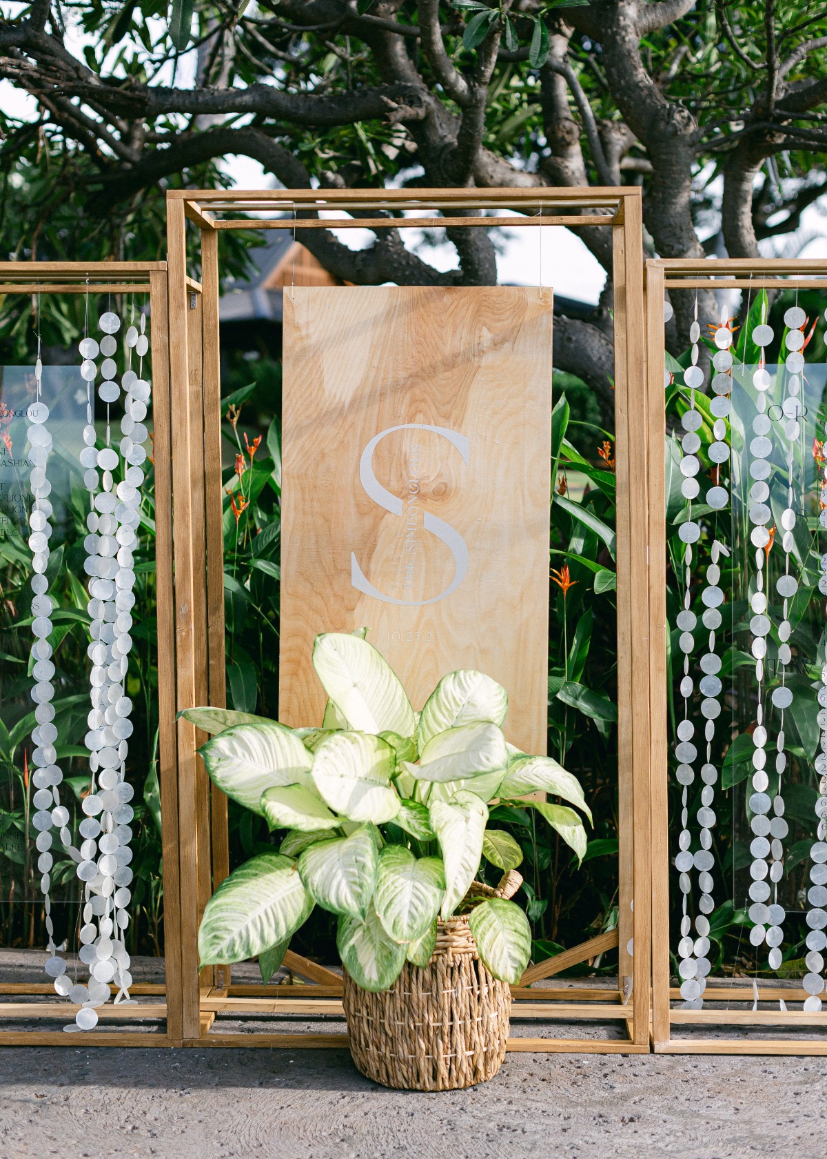 modern seashell and glass escort display at hawiian wedding