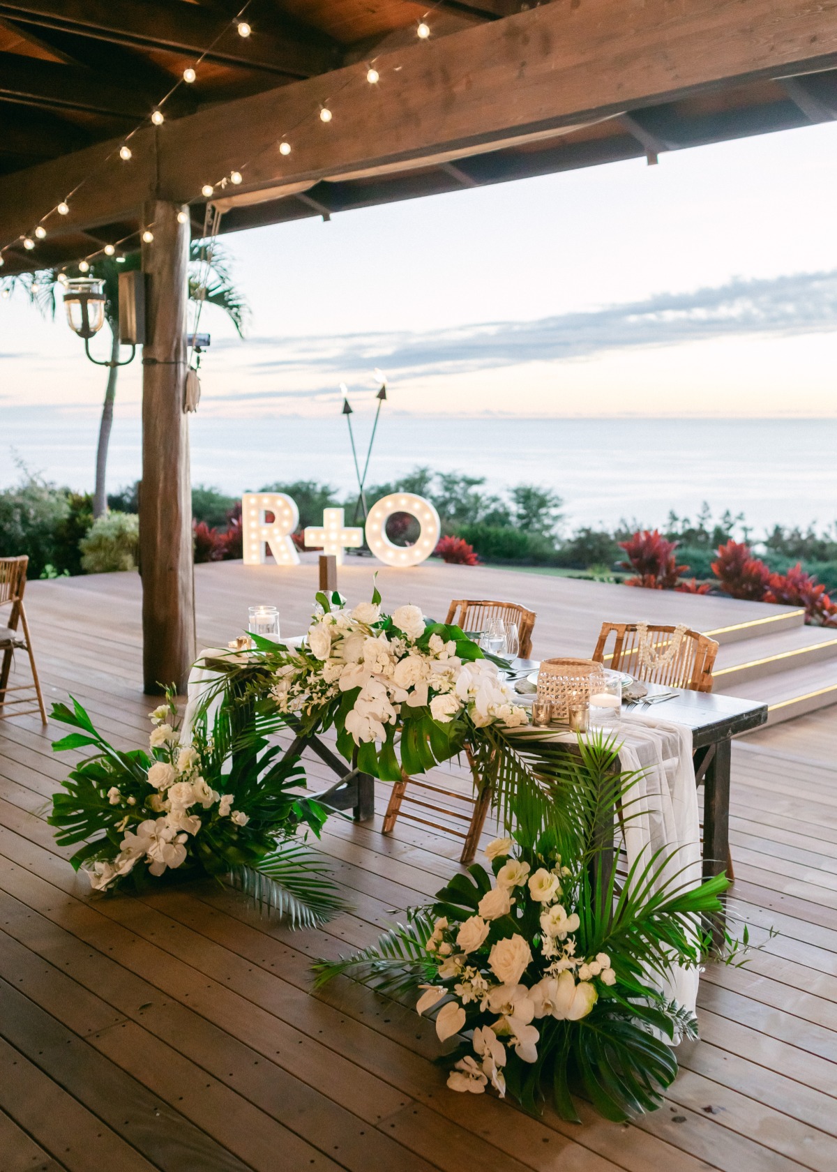 sweetheart table at tropical wedding reception