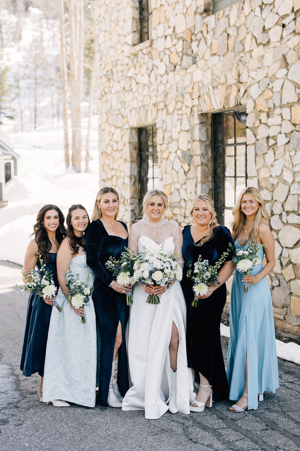 winter wedding with bridesmaids in blue