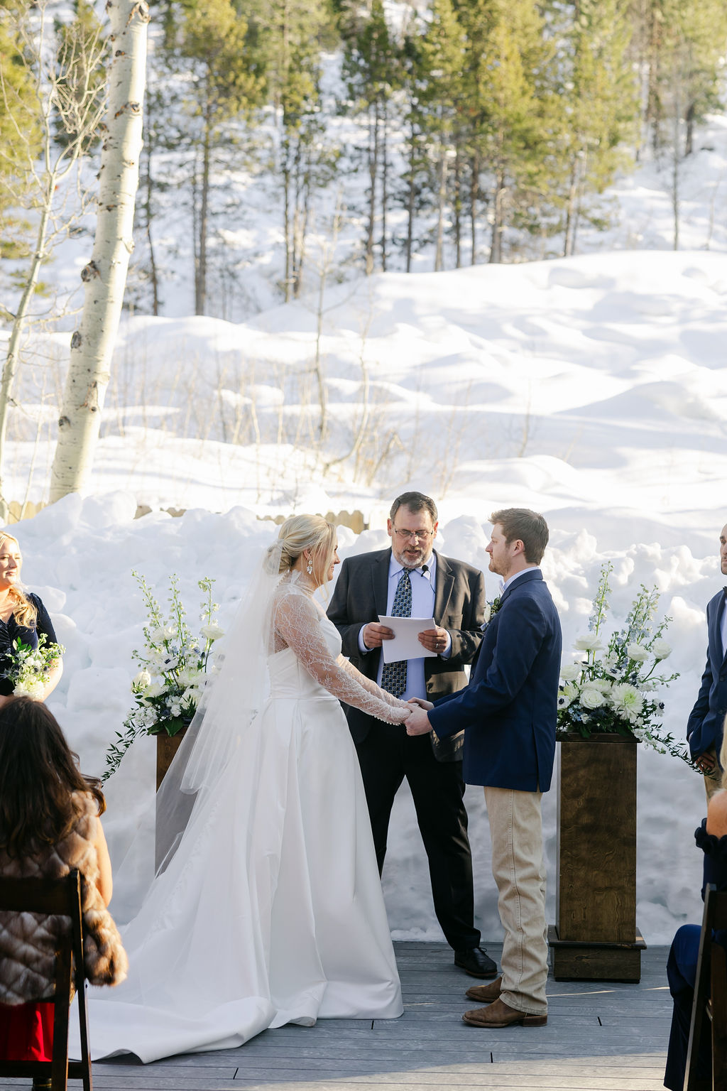 outdoor winter wedding ceremony with snow