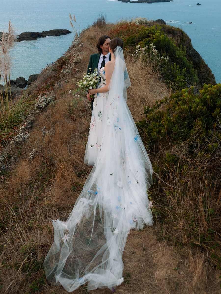 This bride wore a floral-covered gown for her coastal farm wedding