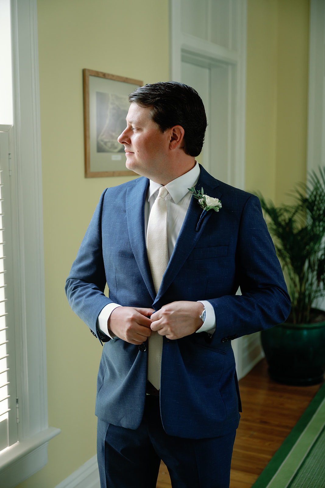 groom in blue suit