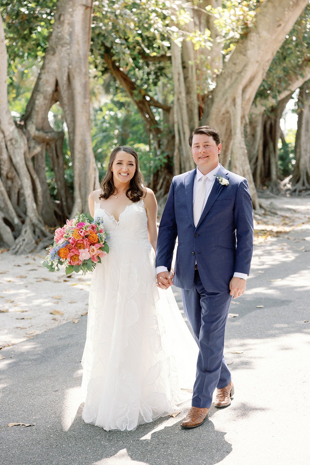 bride and groom walking in florida garden