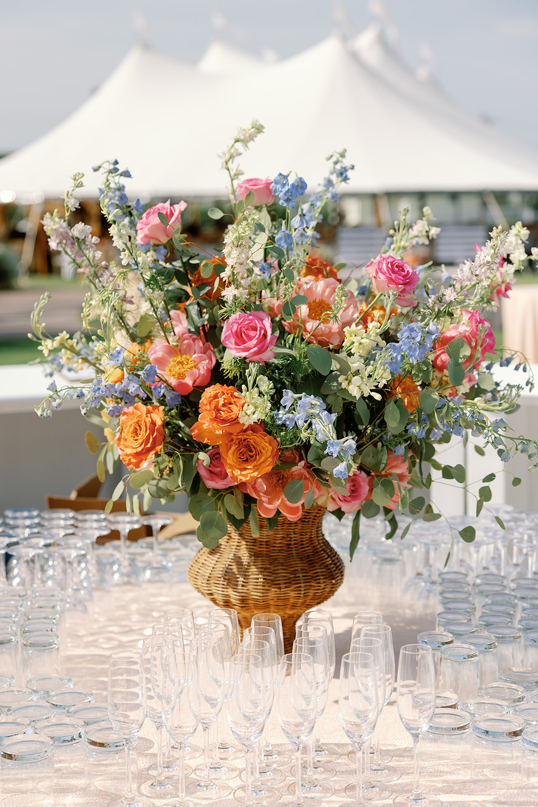 colorful flower arrangement in a wicker vessle