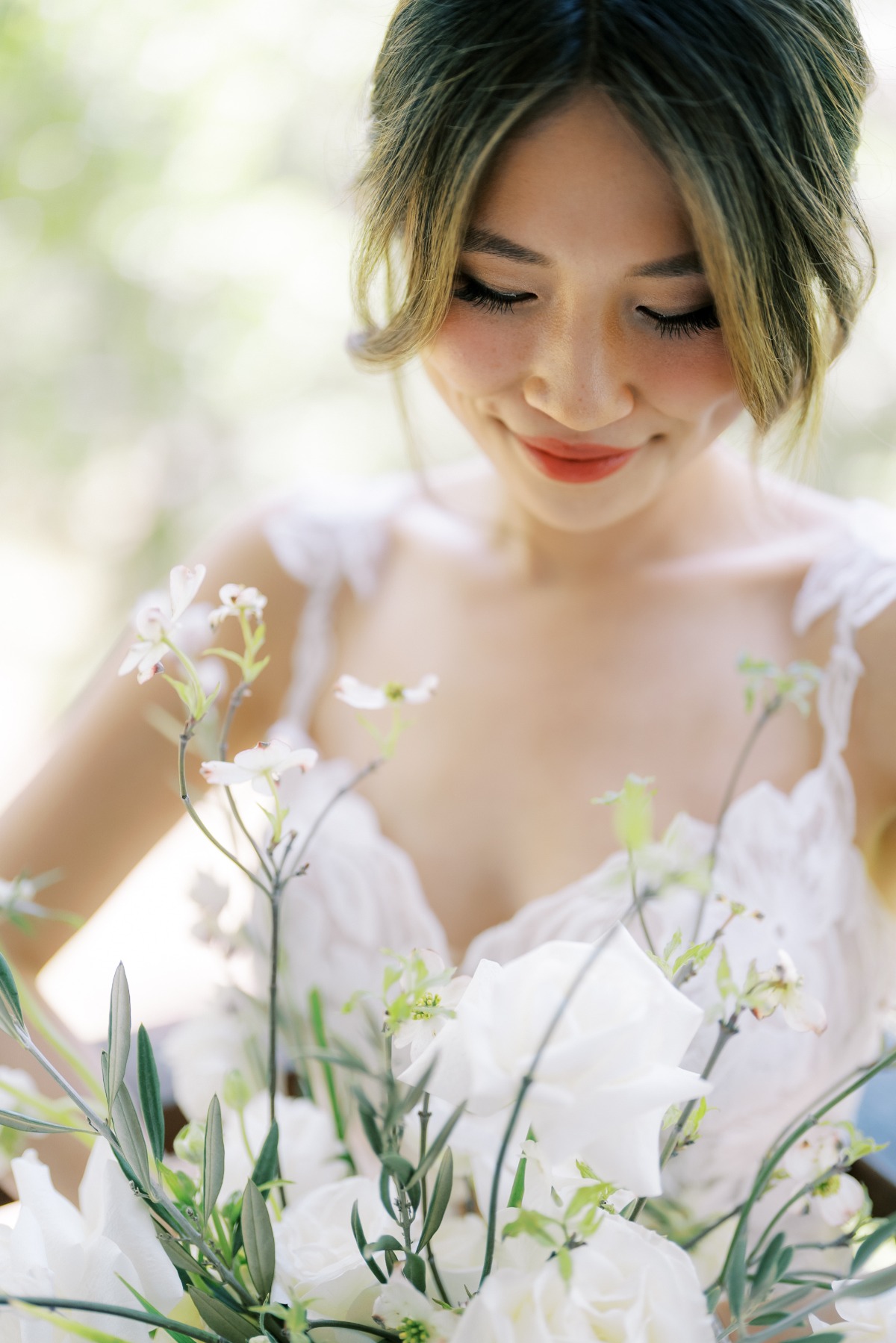 bride with tousled updo and lace wedding dress