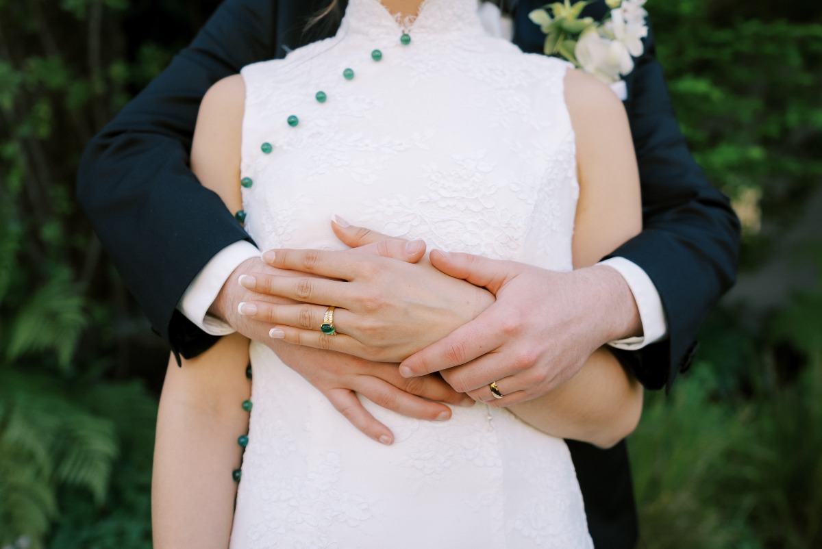 white qipao with jade buttons