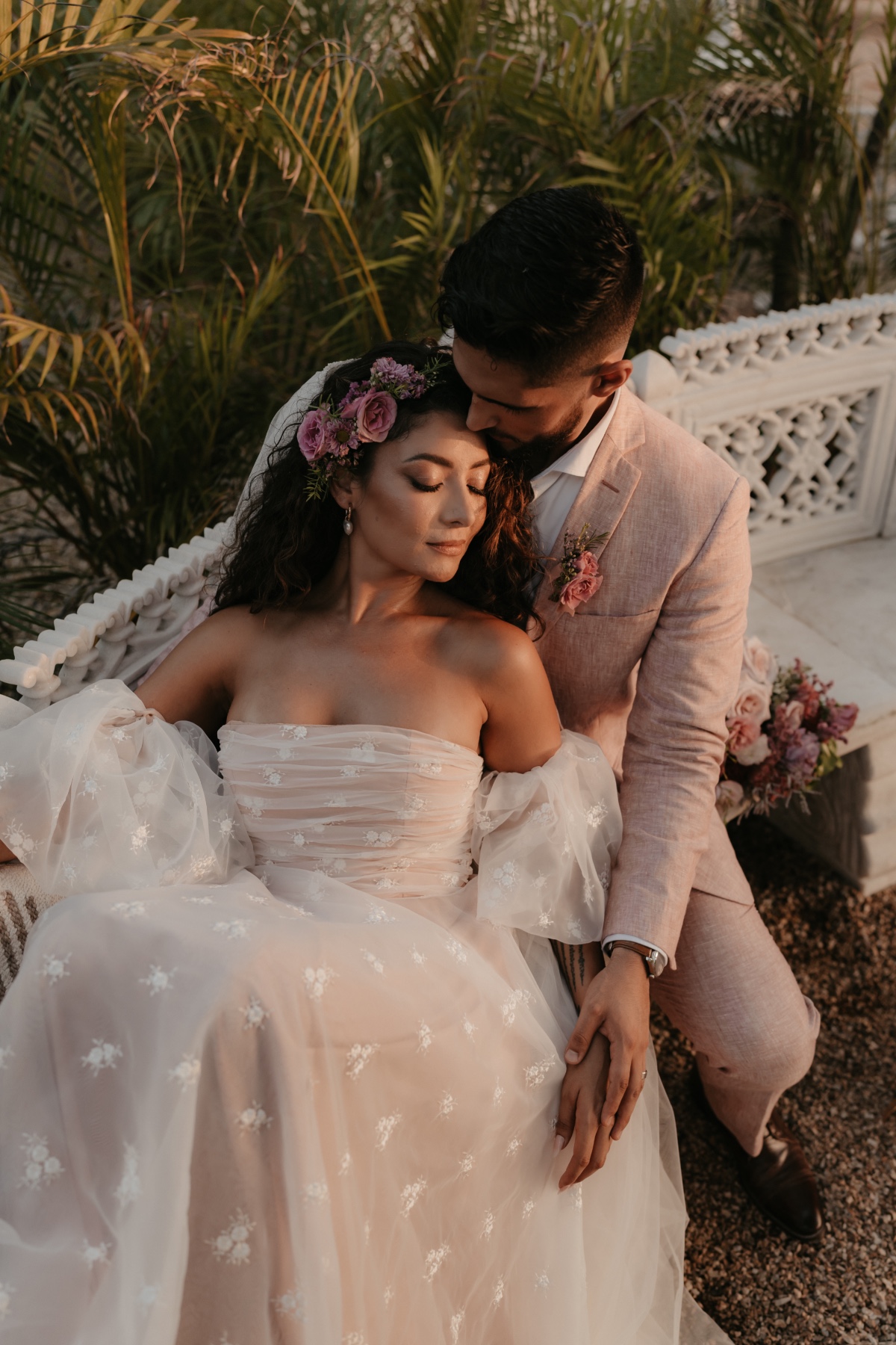 bride and groom in blush outfits