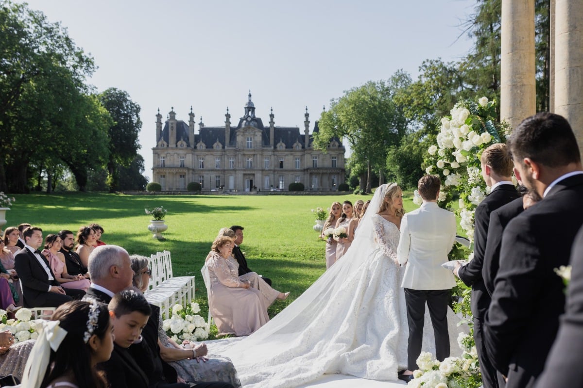 bride and groom at outdoor garden wedding ceremony in paris