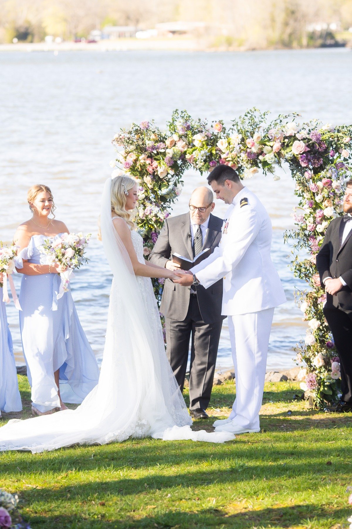 lakefront wedding ceremony with lilac blush and blue flowers