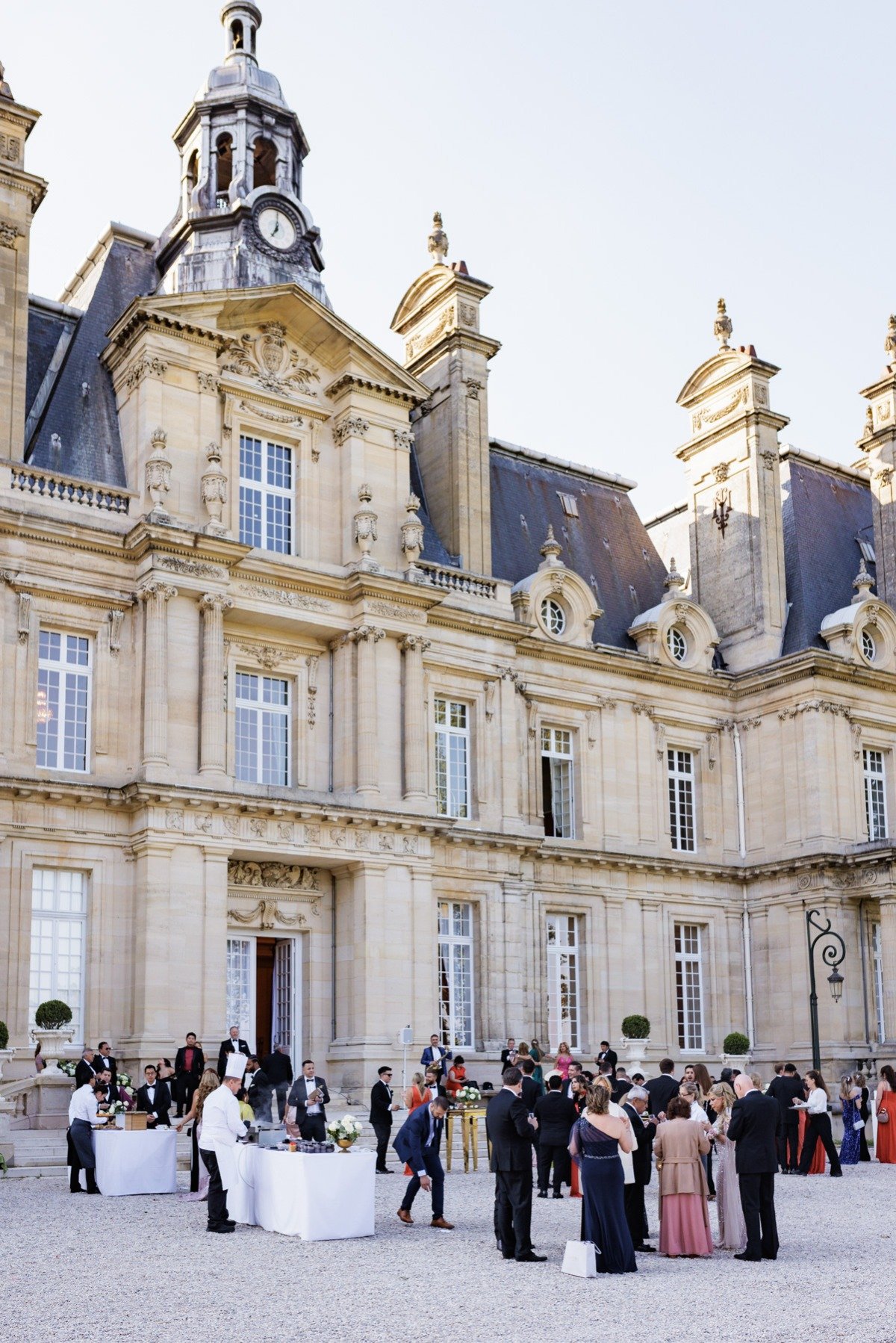 cocktail hour in front of a french chateau