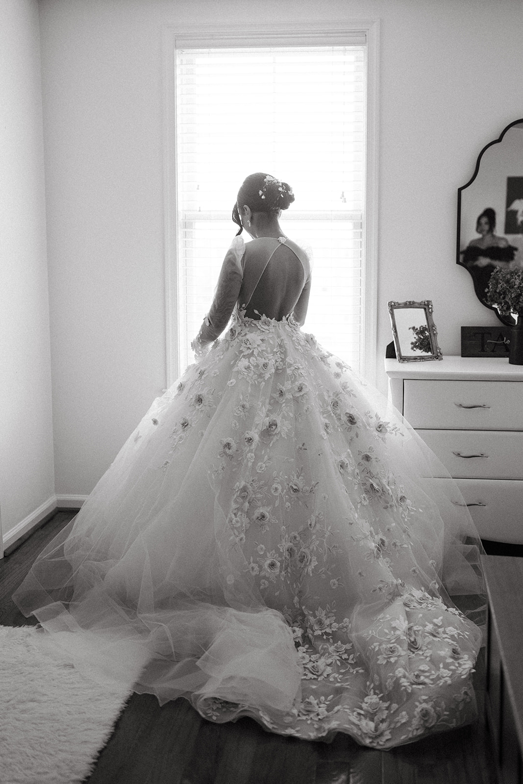 bride getting ready in tulle ballgown with long sleeves