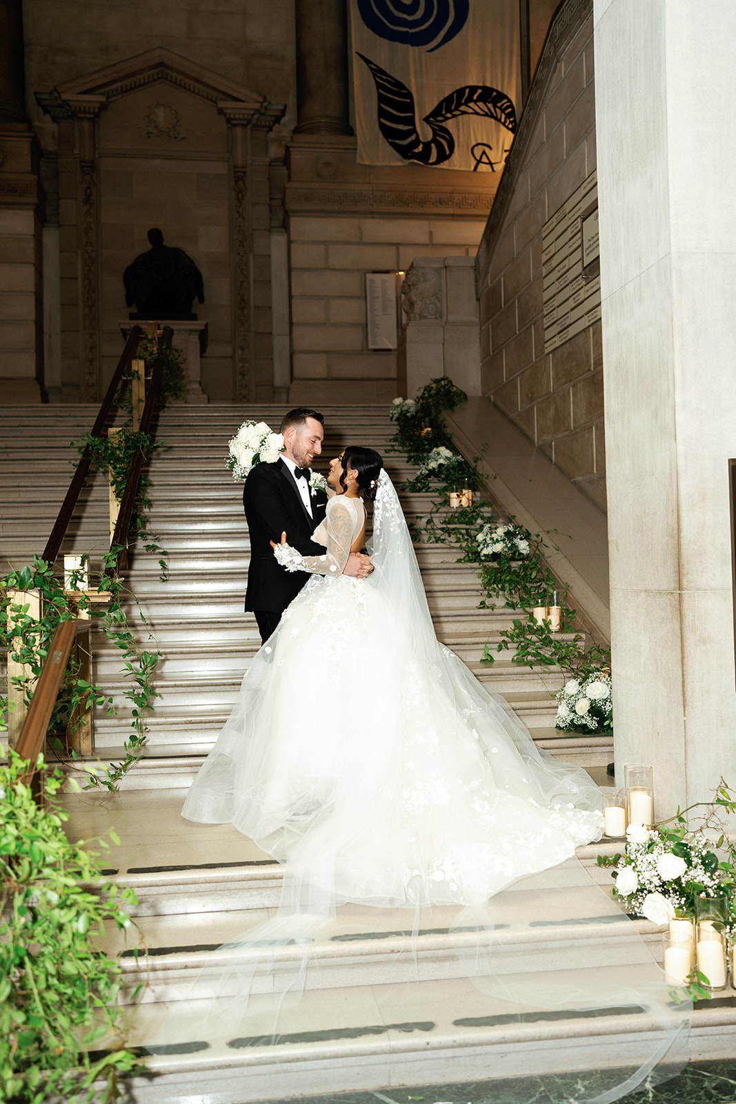 bride and groom on vine covered staircase for wedding