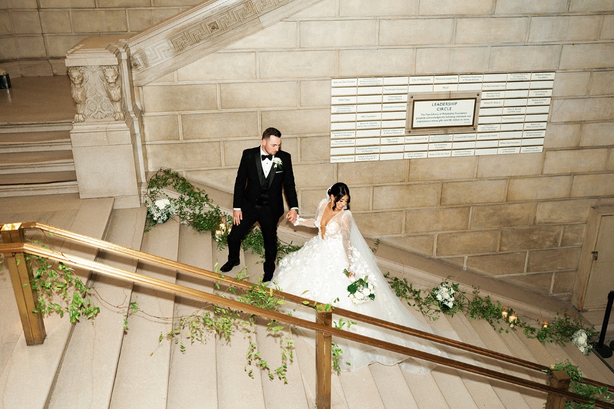 bride and groom on staircase for wedding ceremony