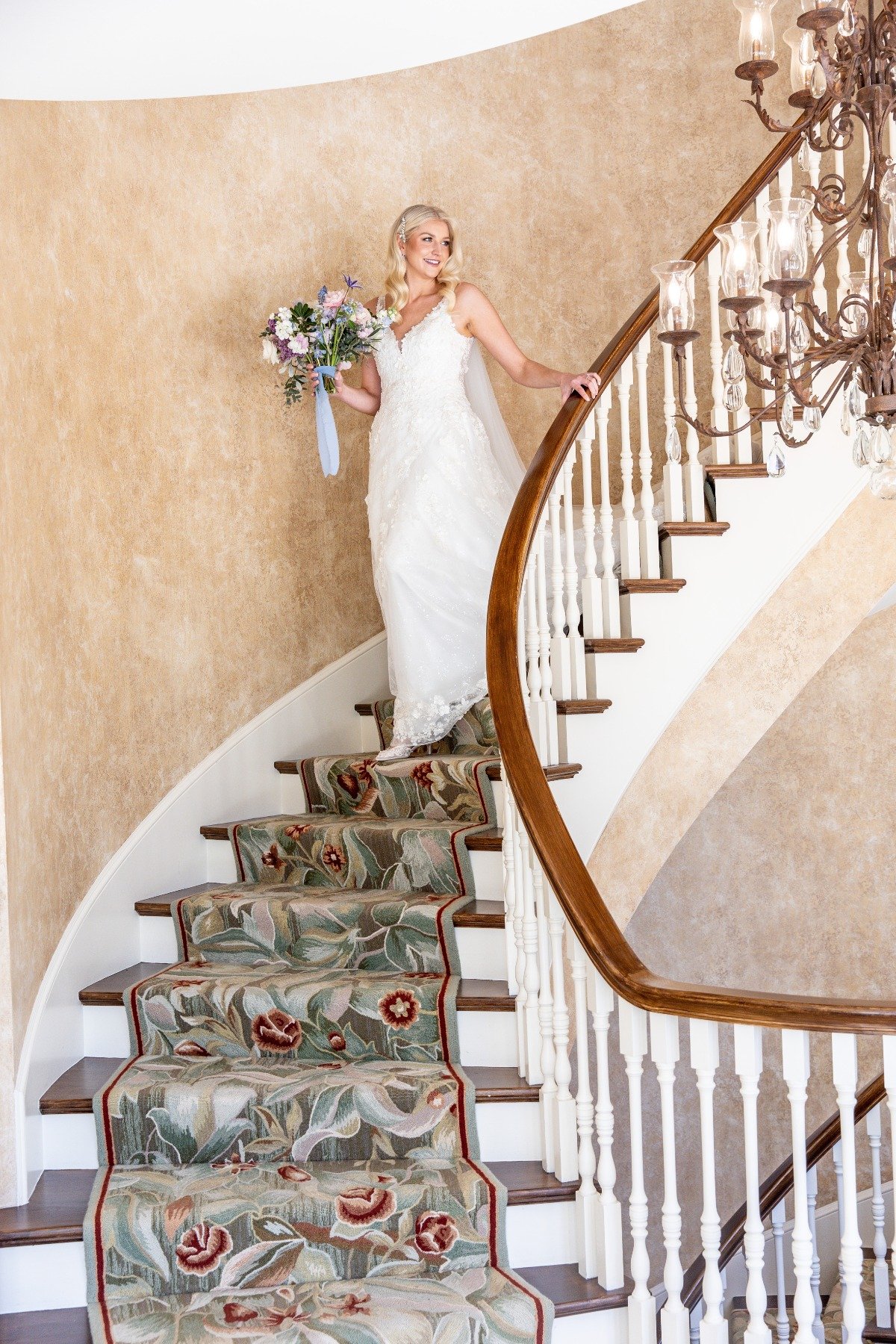 bride walking down elegant staircase