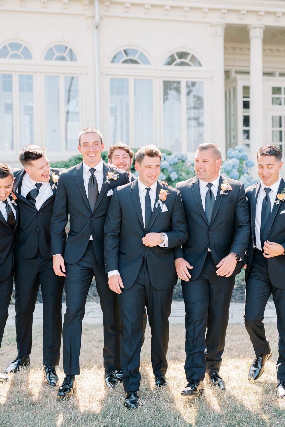 groom and groomsmen in black suits