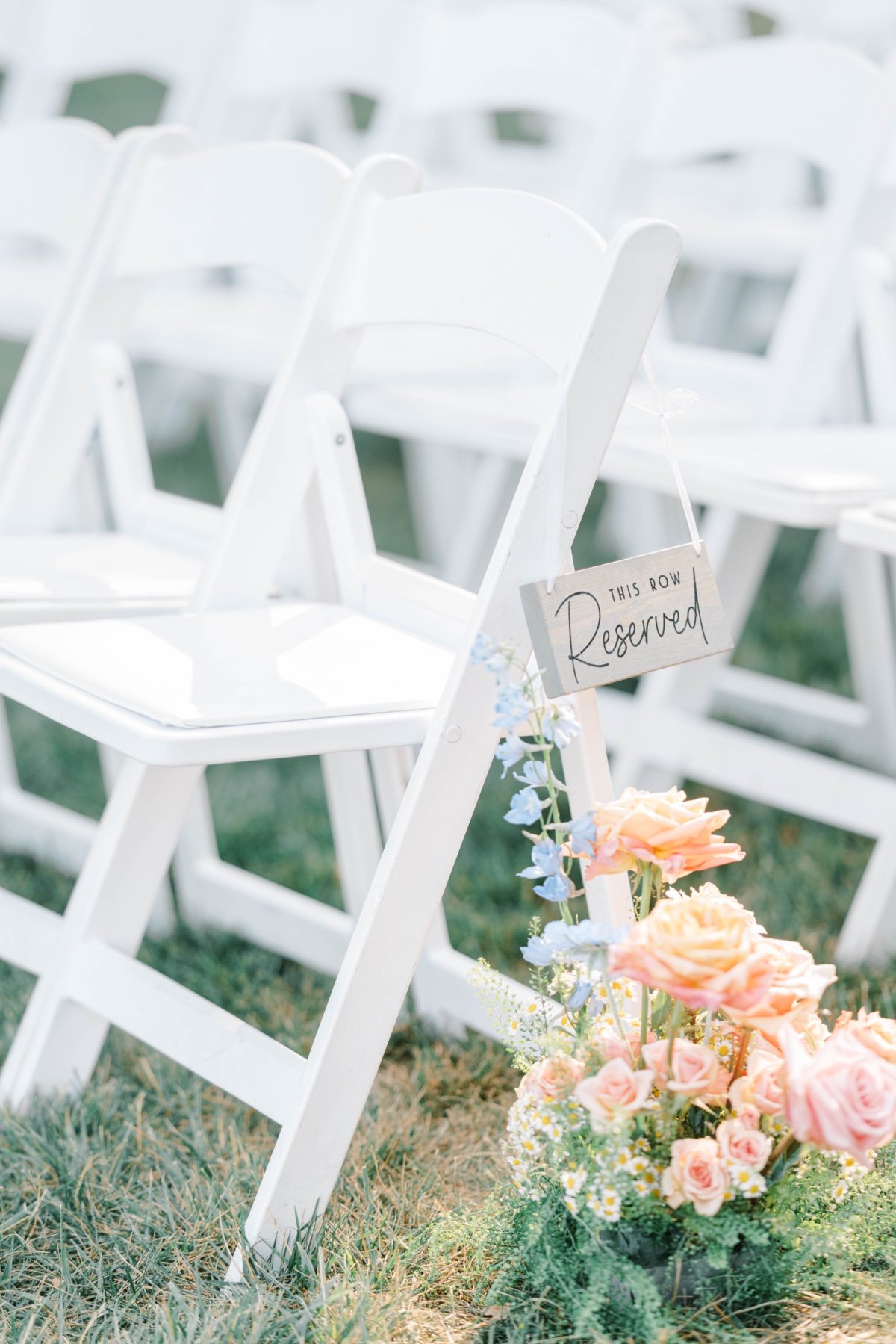 small pastel floral arrangements for wedding aisle