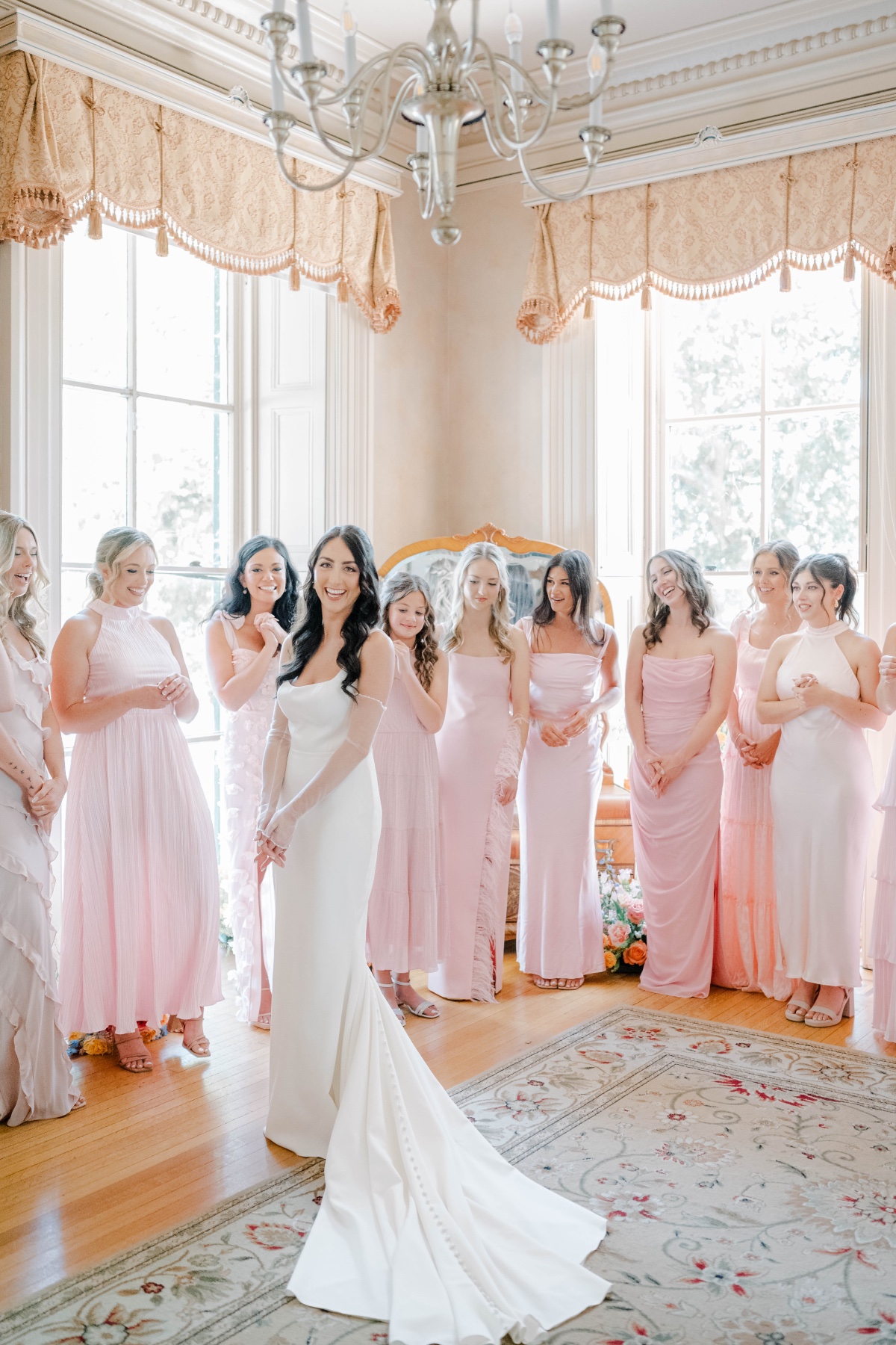 bride with mix and match blush bridesmaids