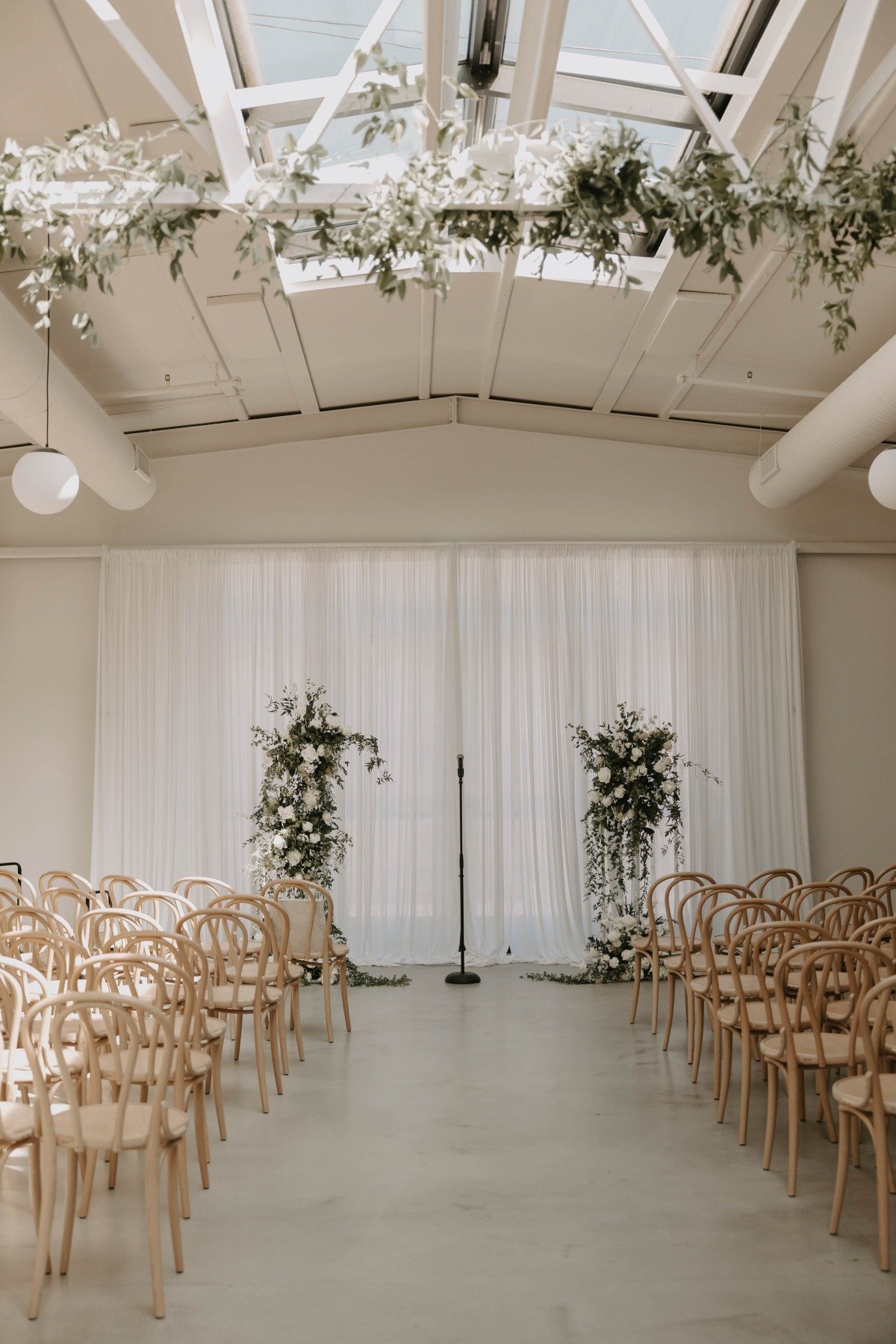 greenery and white rose floral columns