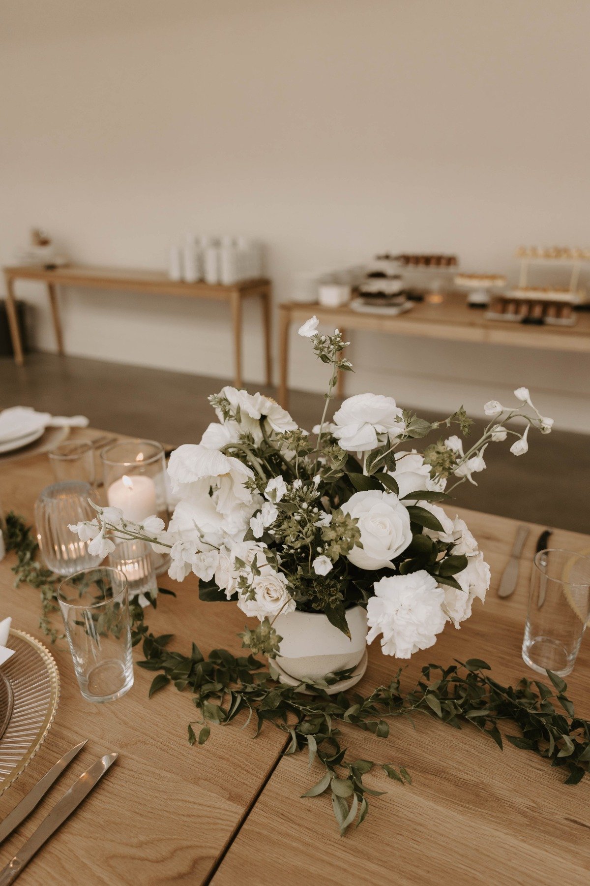 white and greenery centerpieces