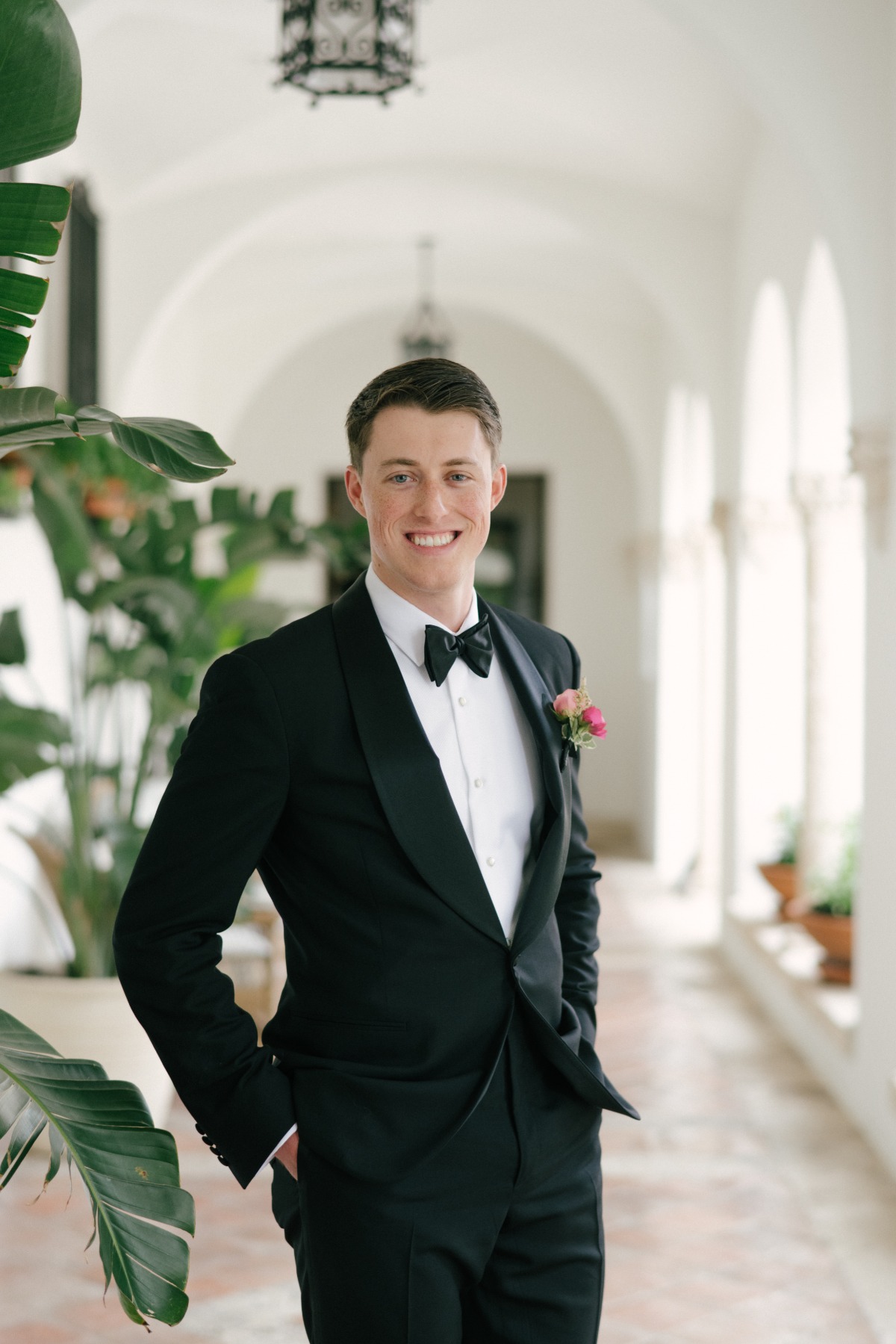 groom in tuxedo at tropical miami wedding