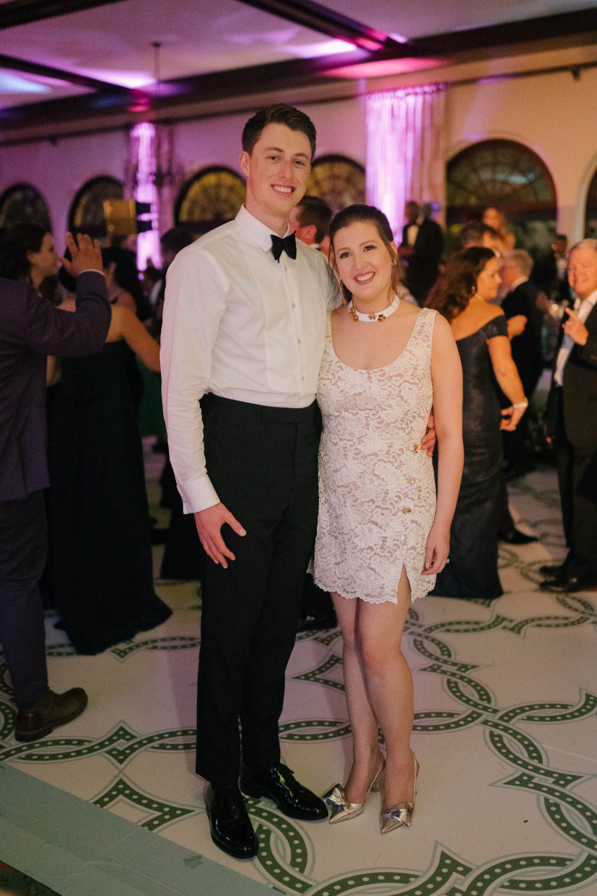 bride and groom at miami reception with bride in mini dress