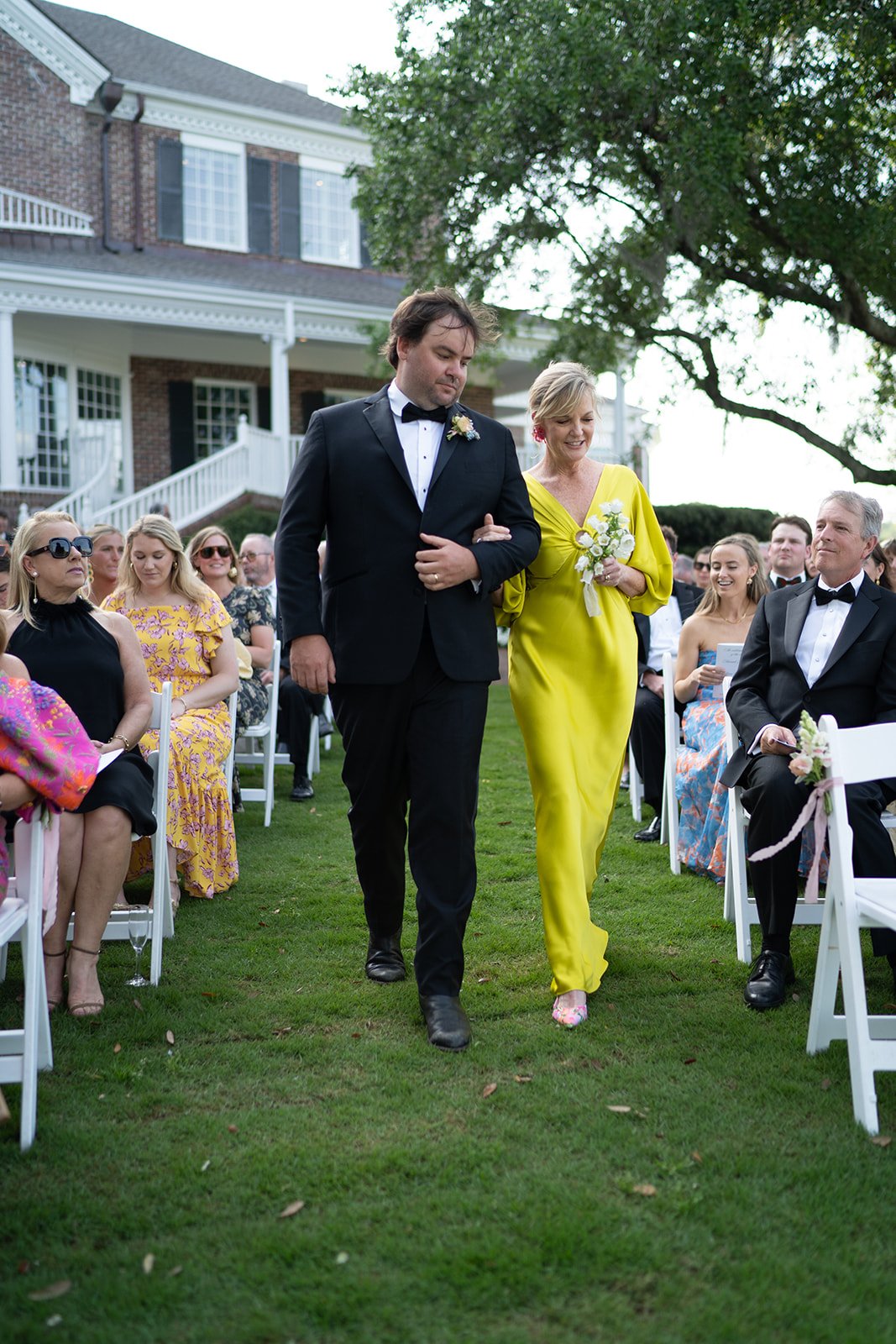 mother of the bride in a bright yellow gown