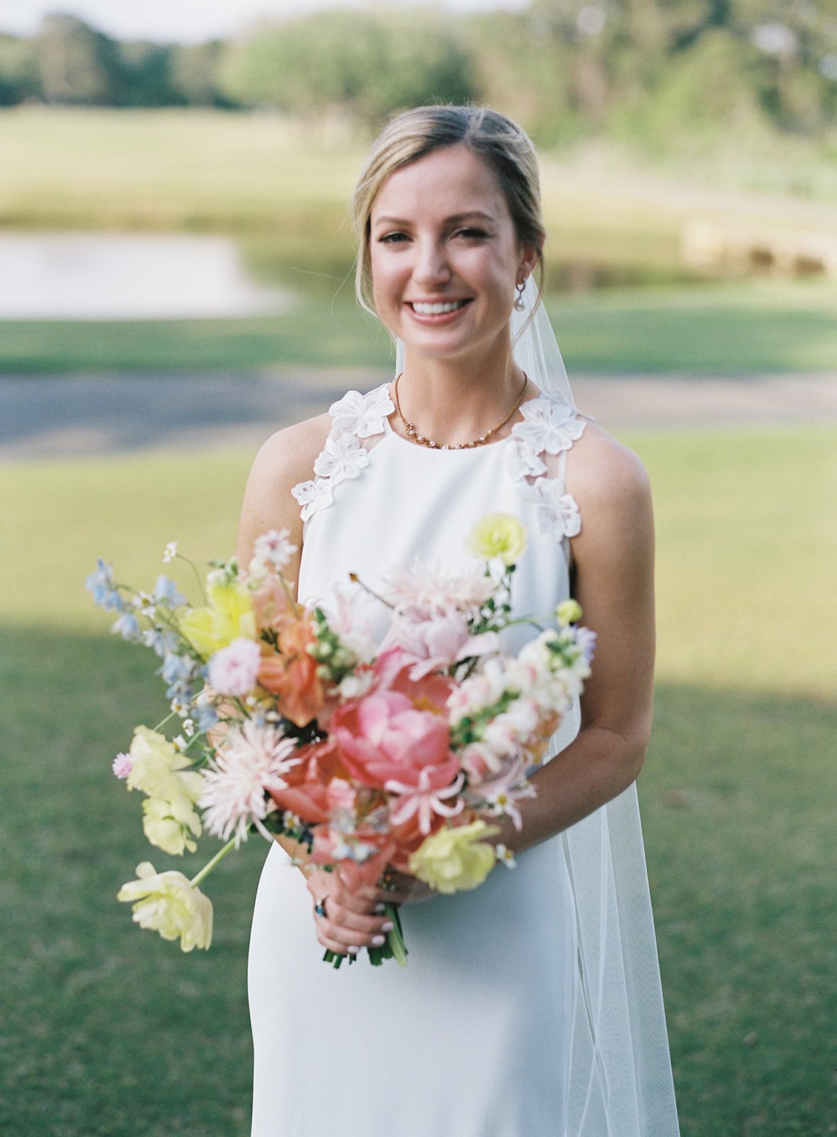 bride with colorful wedding bouquet