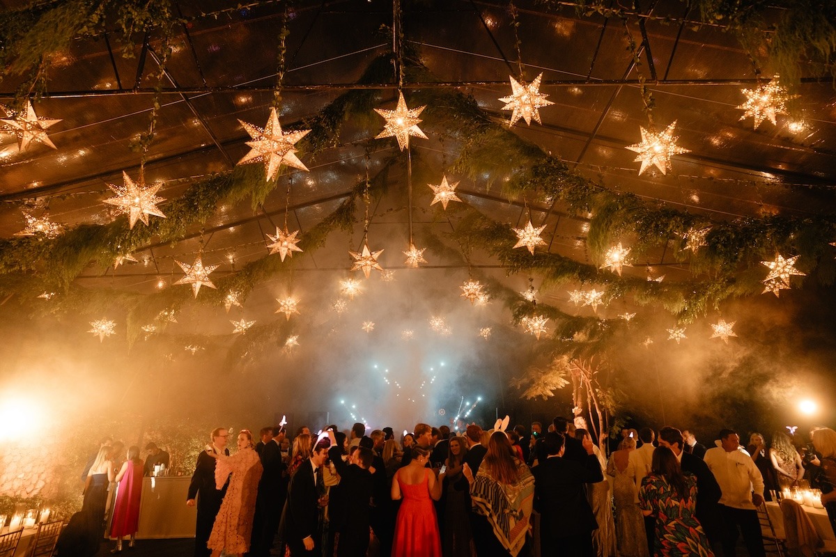 star lanterns and fog on dance floor at wedding reception in mexico