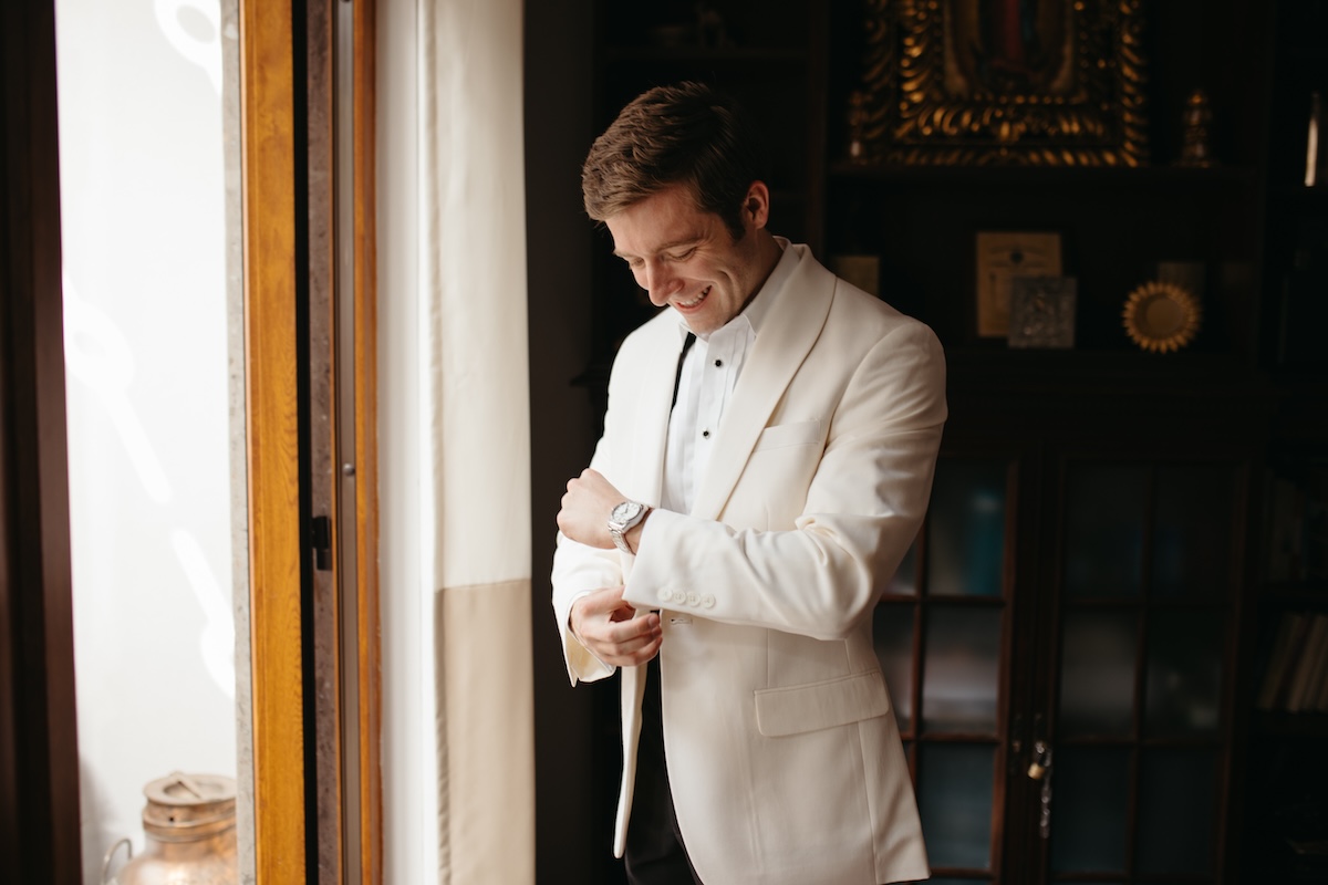 groom in ivory tuxedo for wedding in mexico