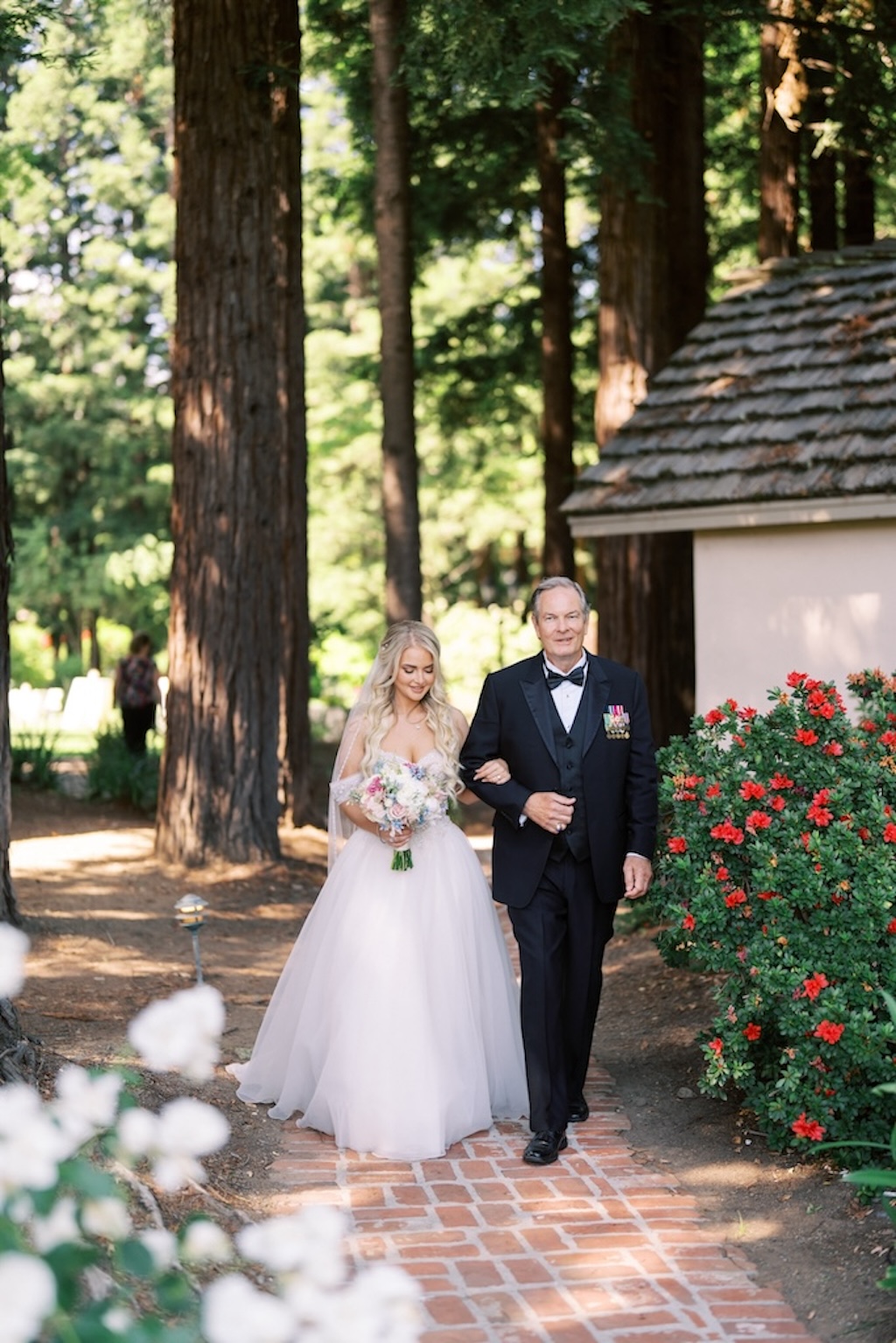 father in tuxedo in redwood forest walking bride down the aisle